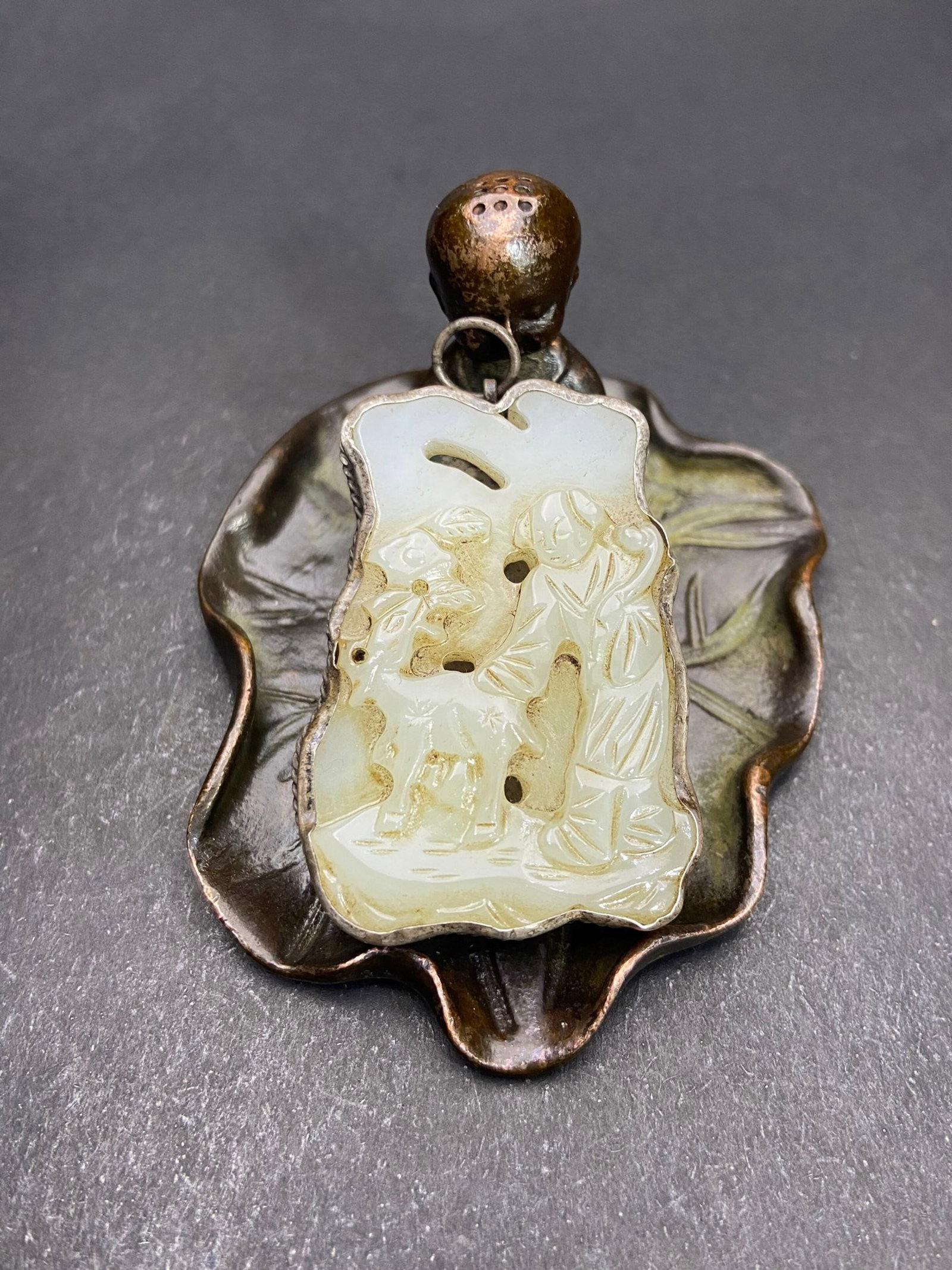 An Exquisite Silver Inlaid White Jade Figure and Deer Pattern Pendant: An Exquisite Silver Inlaid White Jade Figure and Deer Pattern Pendant,Qing Dynasty,China,Size:49mmx34.7mmx8.8mm,Weight:30g 银镶白玉人物鹿纹挂Ê