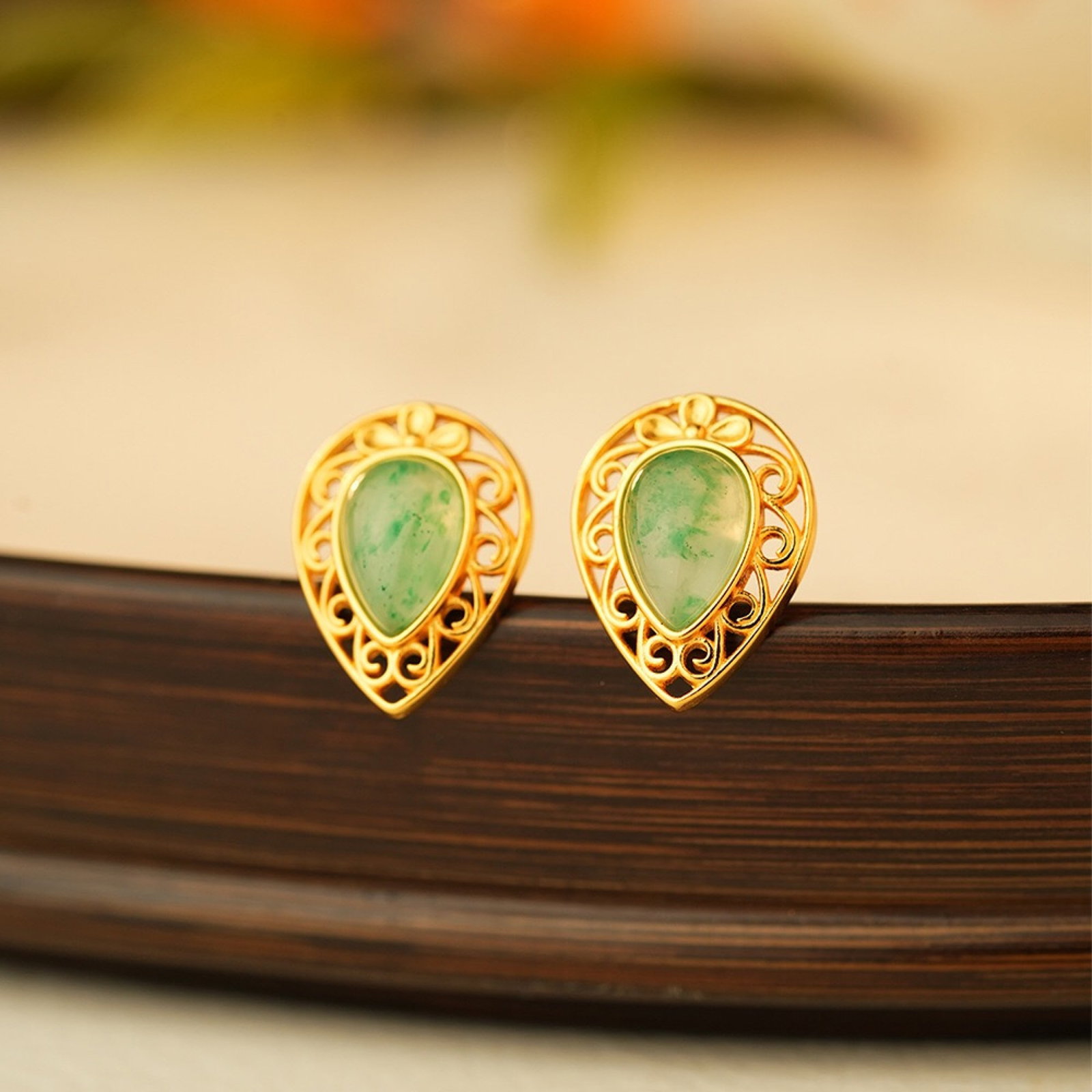 A Pair of Exquisite Sterling Silver-Gold Plated Inlaid Jadeite Earrings: A Pair of Exquisite Sterling Silver-Gold Plated Inlaid Jadeite Earrings,Size:12mmx15mm,Weight:2.1g 一对纯银镀金镶翡翠耳钉