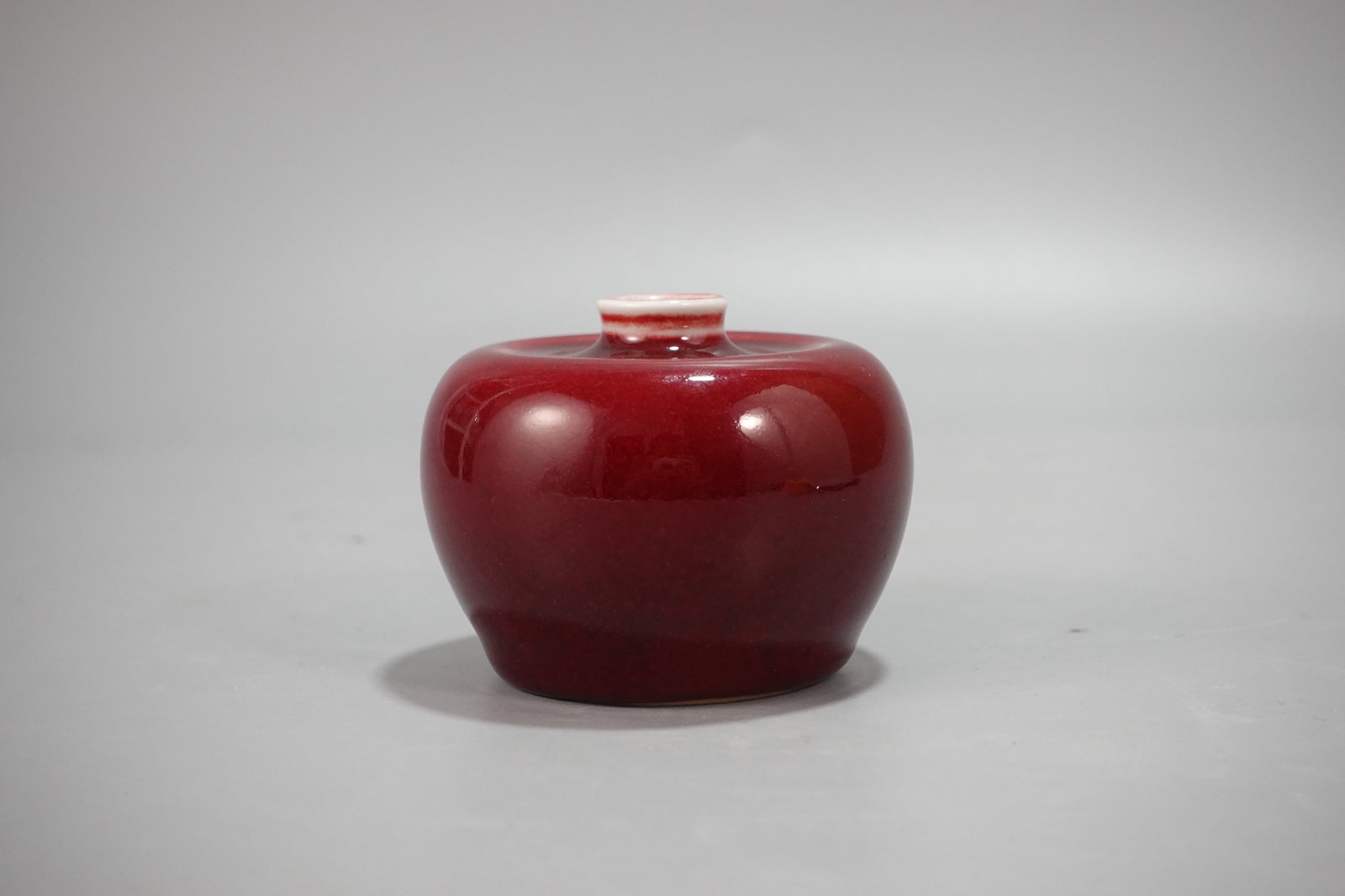 An Exquisite Ji Red Glazed Apple-Shaped Vase: An Exquisite Ji Red Glazed Apple-Shaped Vase,Qing Dynasty,China,Kangxi Six-character Mark,Size:2.4inx3in 霁红釉苹果形瓶,中国清代,ò