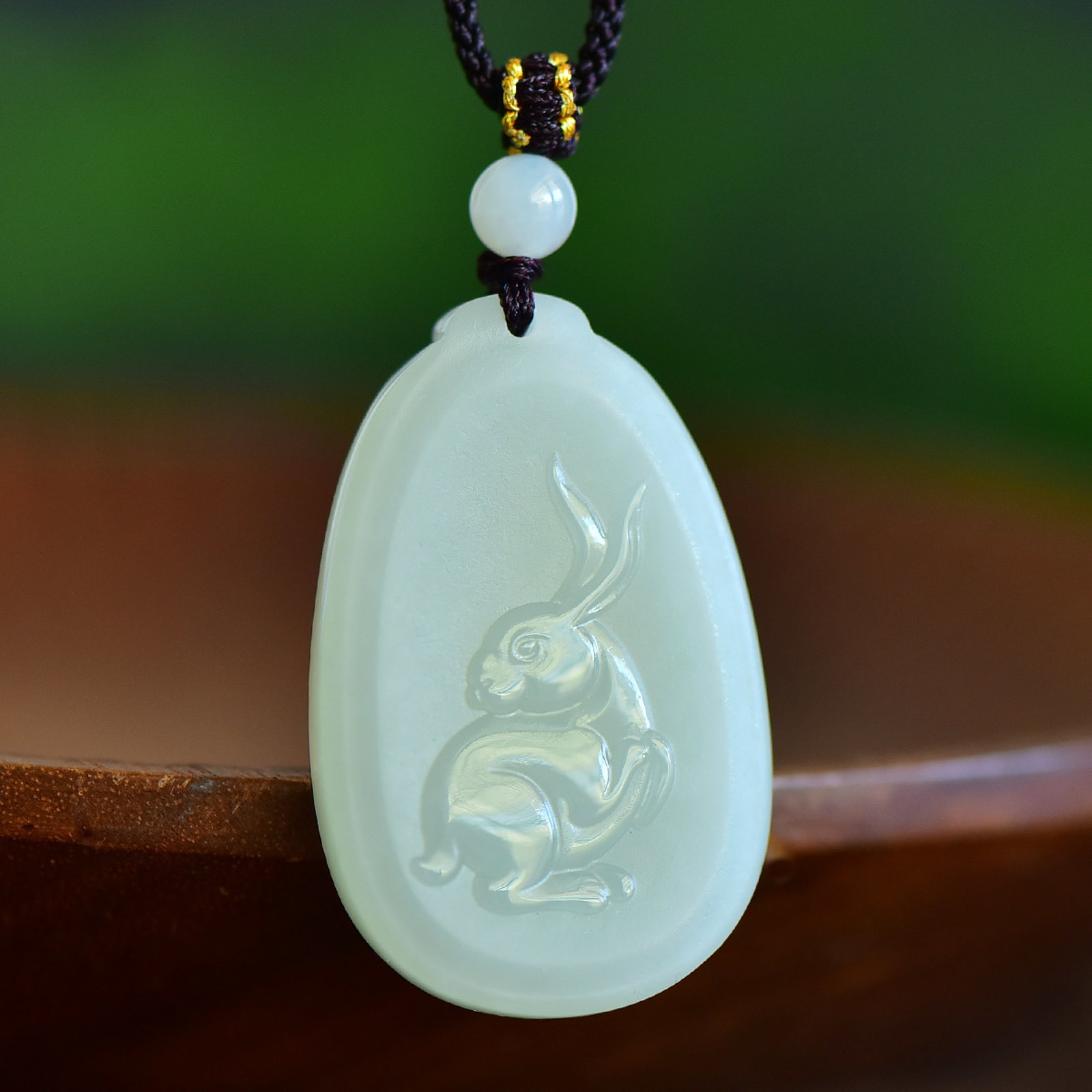 An Exquisite White Jade Rabbit Pattern Pendant: An Exquisite White Jade Rabbit Pattern Pendant,Size:41mmx26mm 寓意:生肖兔佩戴,佩戴可使一生顺利,逢凶