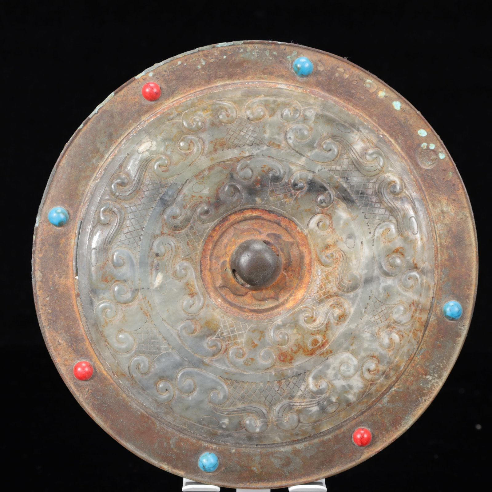 An Archaic Bronze Auspicious Cloud Pattern Round Mirror,Inlaid Gems: An Archaic Bronze Auspicious Cloud Pattern Round Mirror,Inlaid Gems,The Warring States period in China,Size:7.1inx0.8in,Weight:950g 青铜祥云纹圆镜,嵌