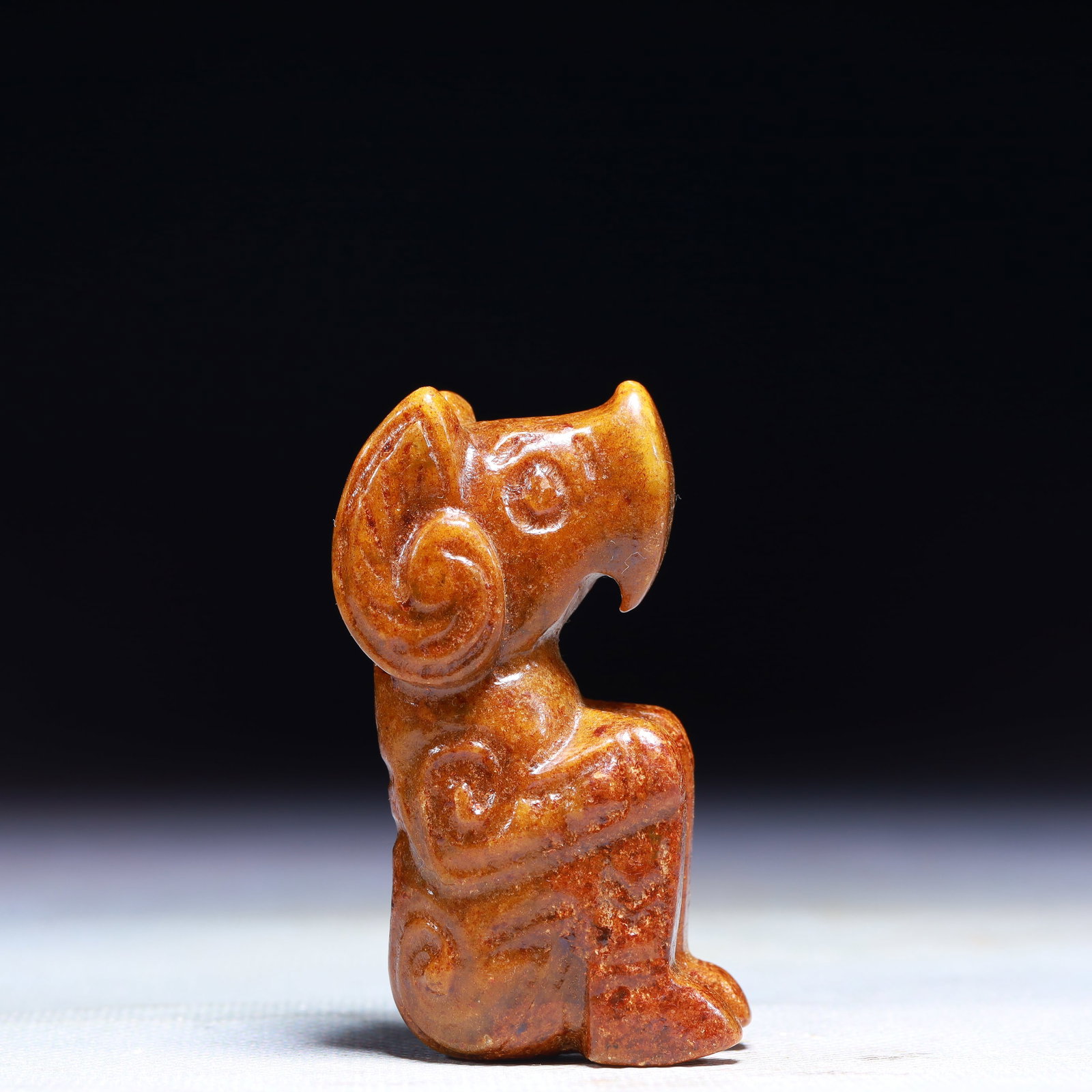 An Exquisite Archaic Jade Sheep Ornament: An Exquisite Archaic Jade Sheep Ornament,Ancient Time,China,Size:1.2inx0.8inx2.6in,Weight:79g 高古玉羊摆件中国远古时期