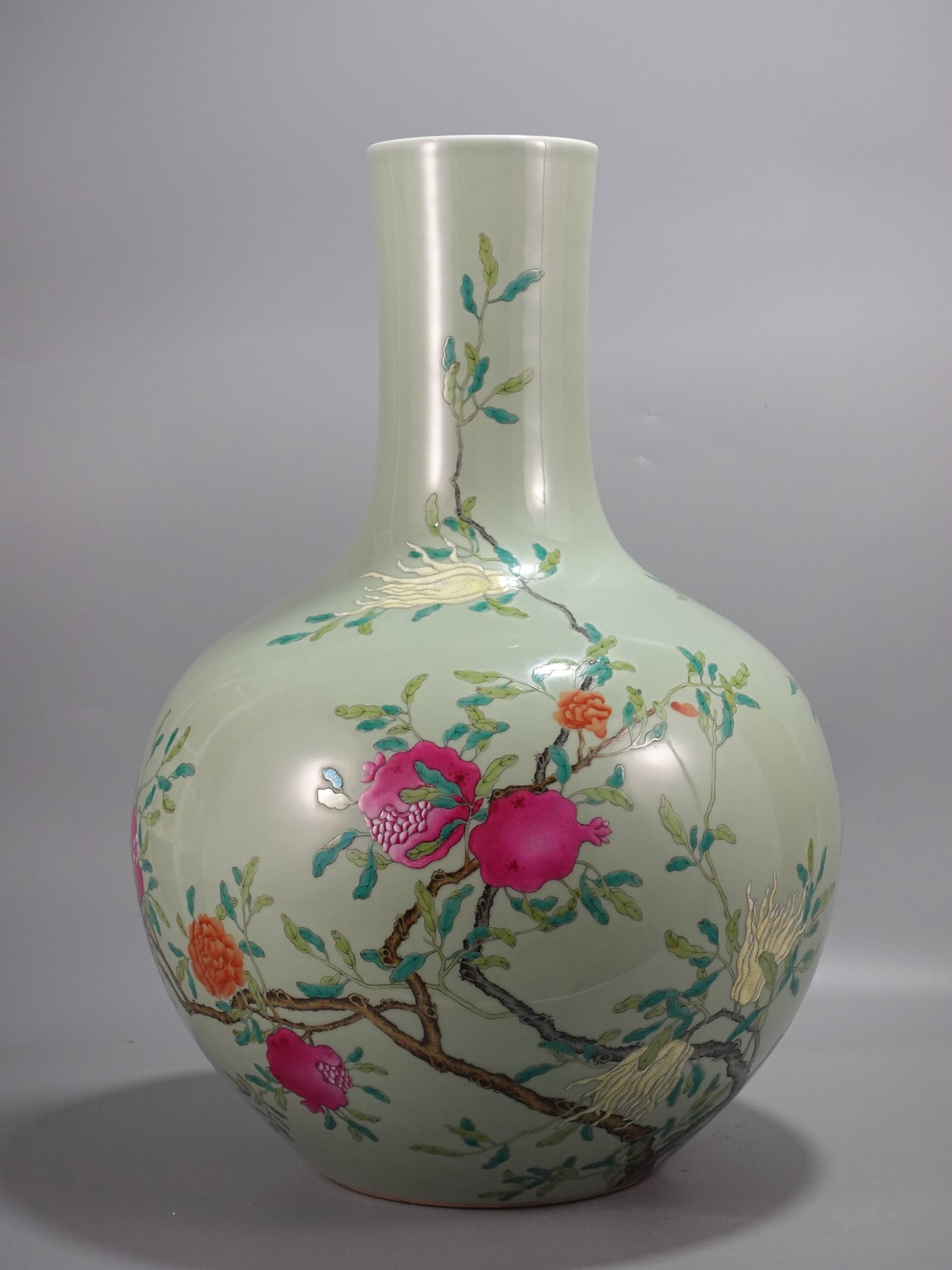 A Huge Celadon Glazed Famille-Rose Fruit Pattern Vase: A Huge Celadon Glazed Famille-Rose Fruit Pattern Vase,Qing Dynasty,China,Qianlong Six-character Mark,Size:22.8inx16.1in 青釉粉彩果纹瓶,中国清