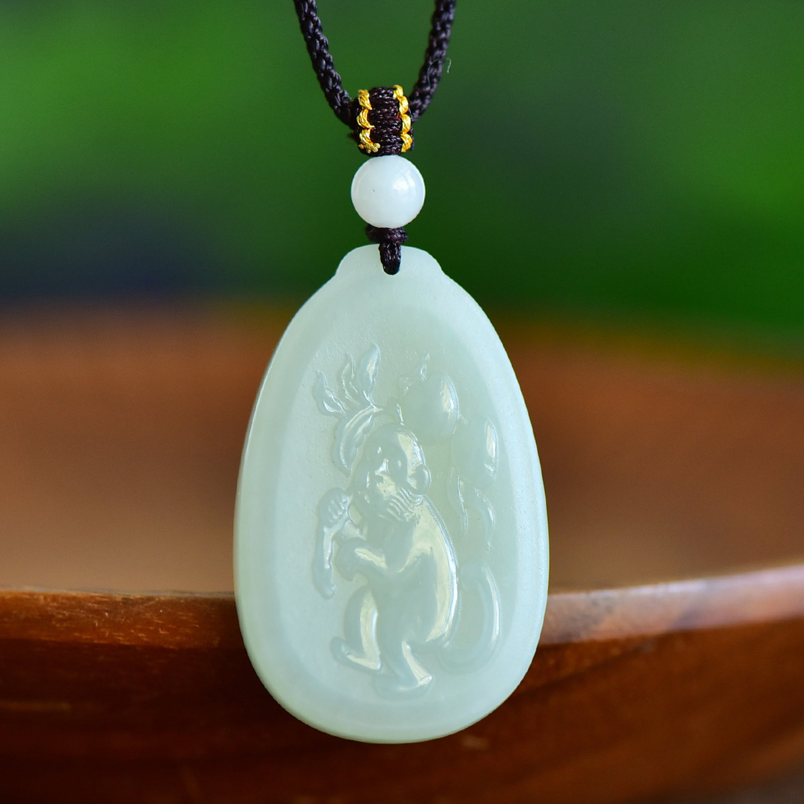 An Exquisite White Jade Monkey Pattern Pendant (1 of 5)