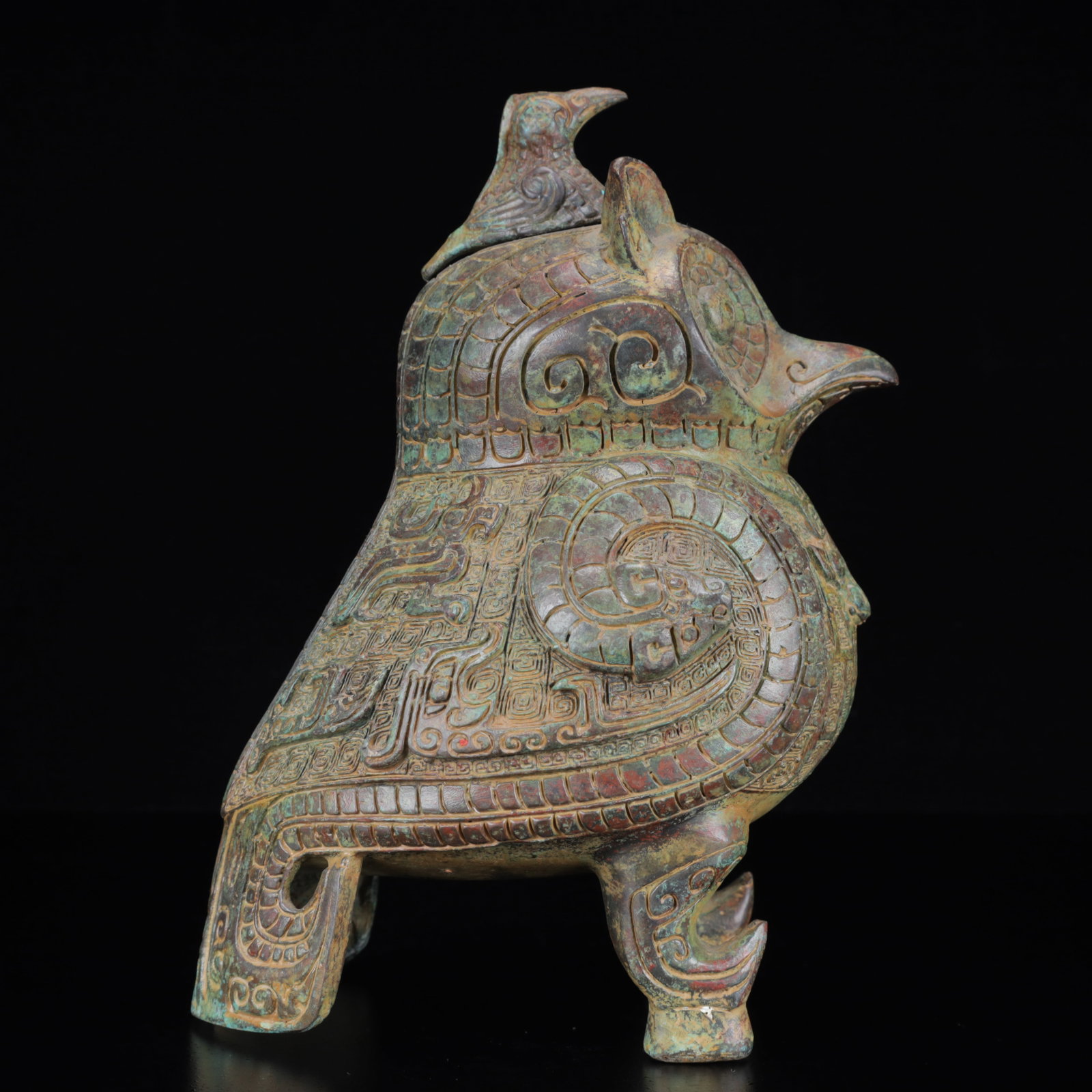 An Archaic Bronze Beast-Face Pattern Bird Pot: An Archaic Bronze Beast-Face Pattern Bird Pot,the Warring States Period in China,Size:7.1inx5.5inx9.8in,Weight:3250g 青铜兽面纹鸟壶,中国战&#