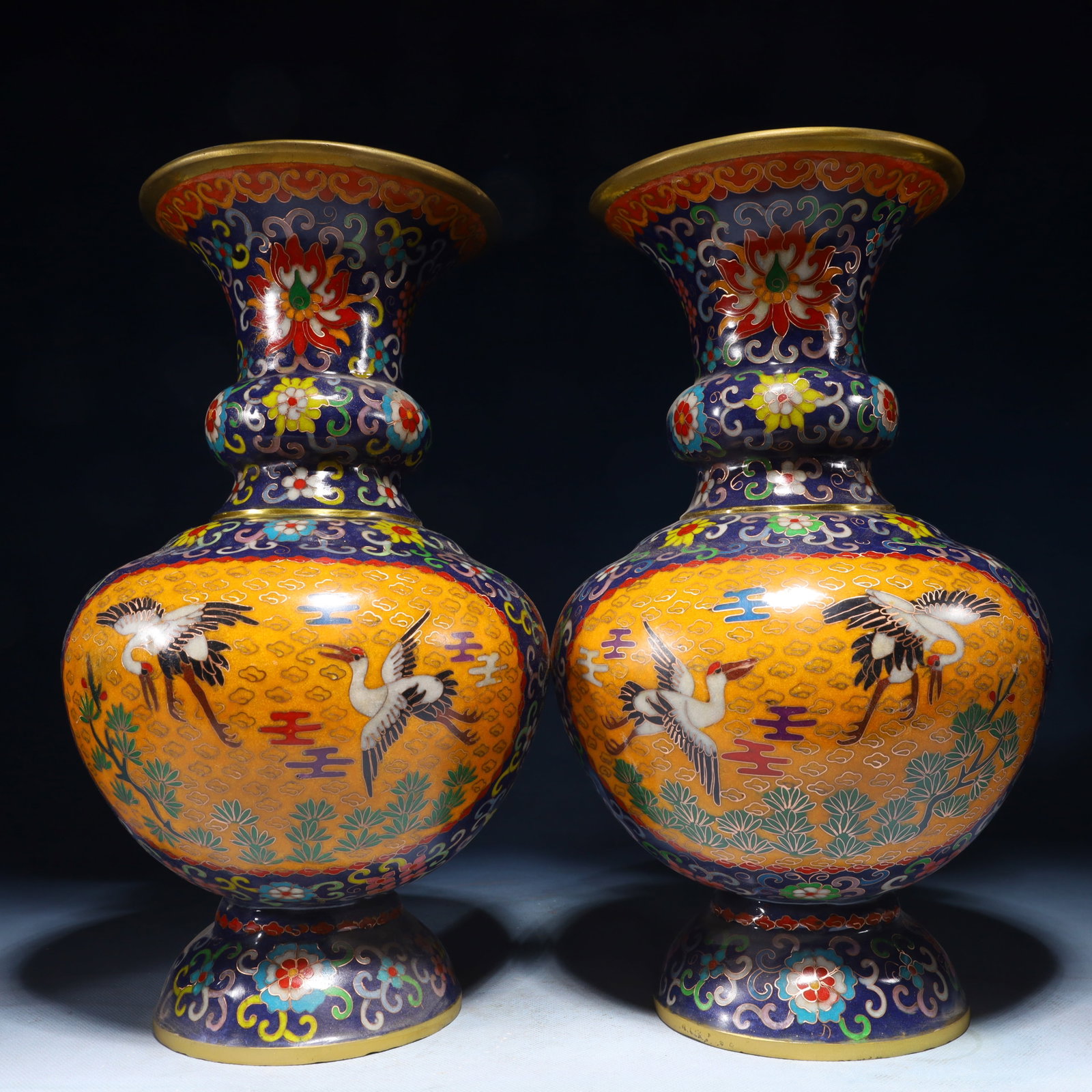 A Pair of Exquisite Cloisonne Lotus and Crane Pattern Vases: A Pair of Exquisite Cloisonne Lotus and Crane Pattern Vases,Qing Dynasty,China,Qianlong Four-character Mark,Size:7.9inx13.8in,Weight:7150g 一对景泰蓝缠枝ő
