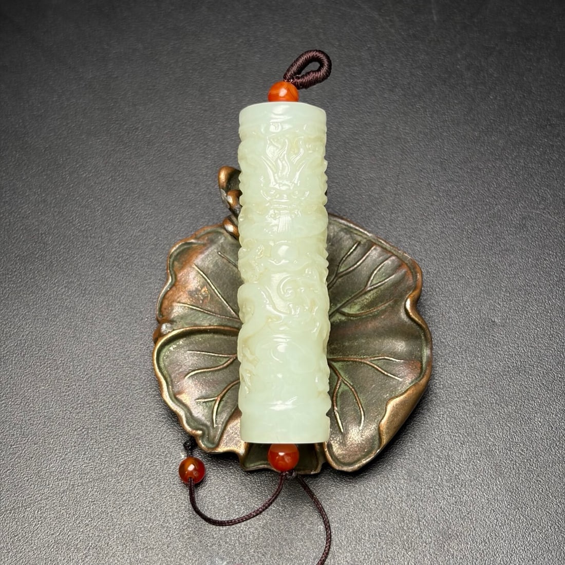 An Exquisite White Jade Auspicious Cloud and Dragon Pattern Pendant: An Exquisite White Jade Auspicious Cloud and Dragon Pattern Pendant,Qing Dynasty,China,Size:14.5mmx54mm,Weight:24g