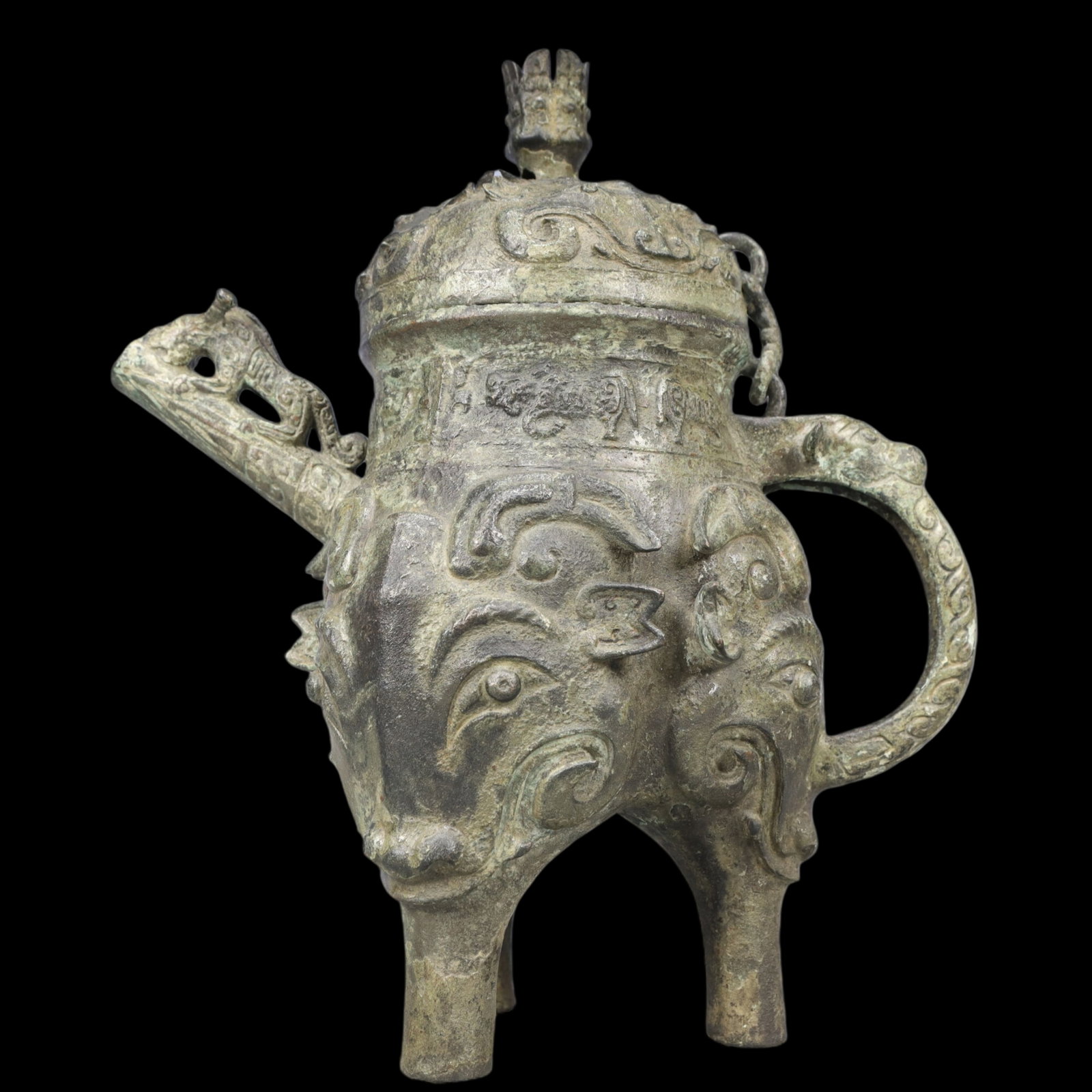 A Rare Bronze Beast-Face Pattern Tripod Ewer ,With Inscription: A Rare Bronze Beast-Face Pattern Tripod Ewer ,With Inscription,Ancient Time, China,Size:10.6inx5.5inx11.8in ;Weight:3650g 青铜兽面纹三足执壶ᦁ