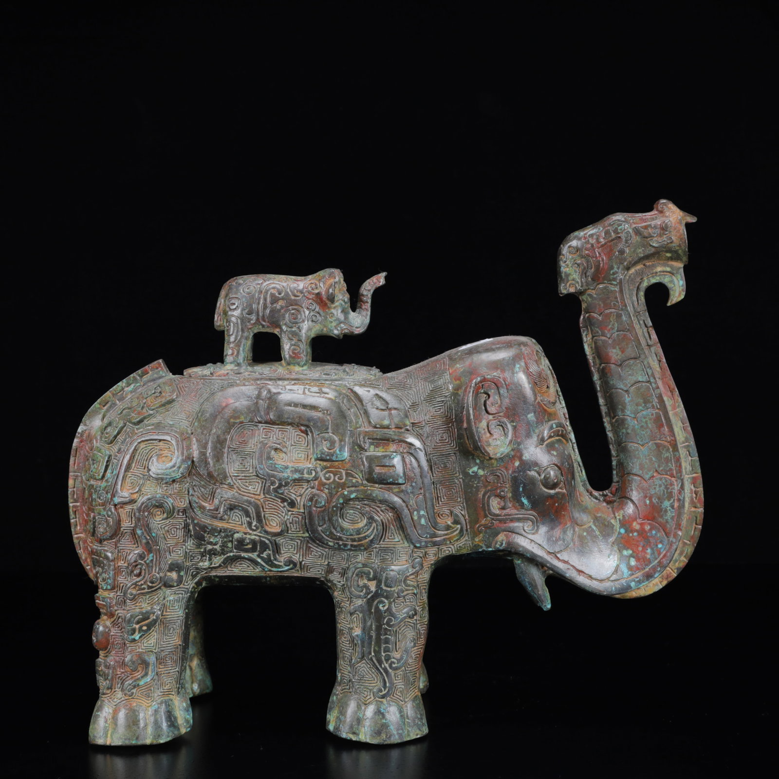 An Archaic Bronze Elephant Censer: An Archaic Bronze Elephant Censer,the Warring States Period in China,Size:11.4inx4.3inx9.4in,Weight:4000g 青铜象纹象香炉,中国战国ą