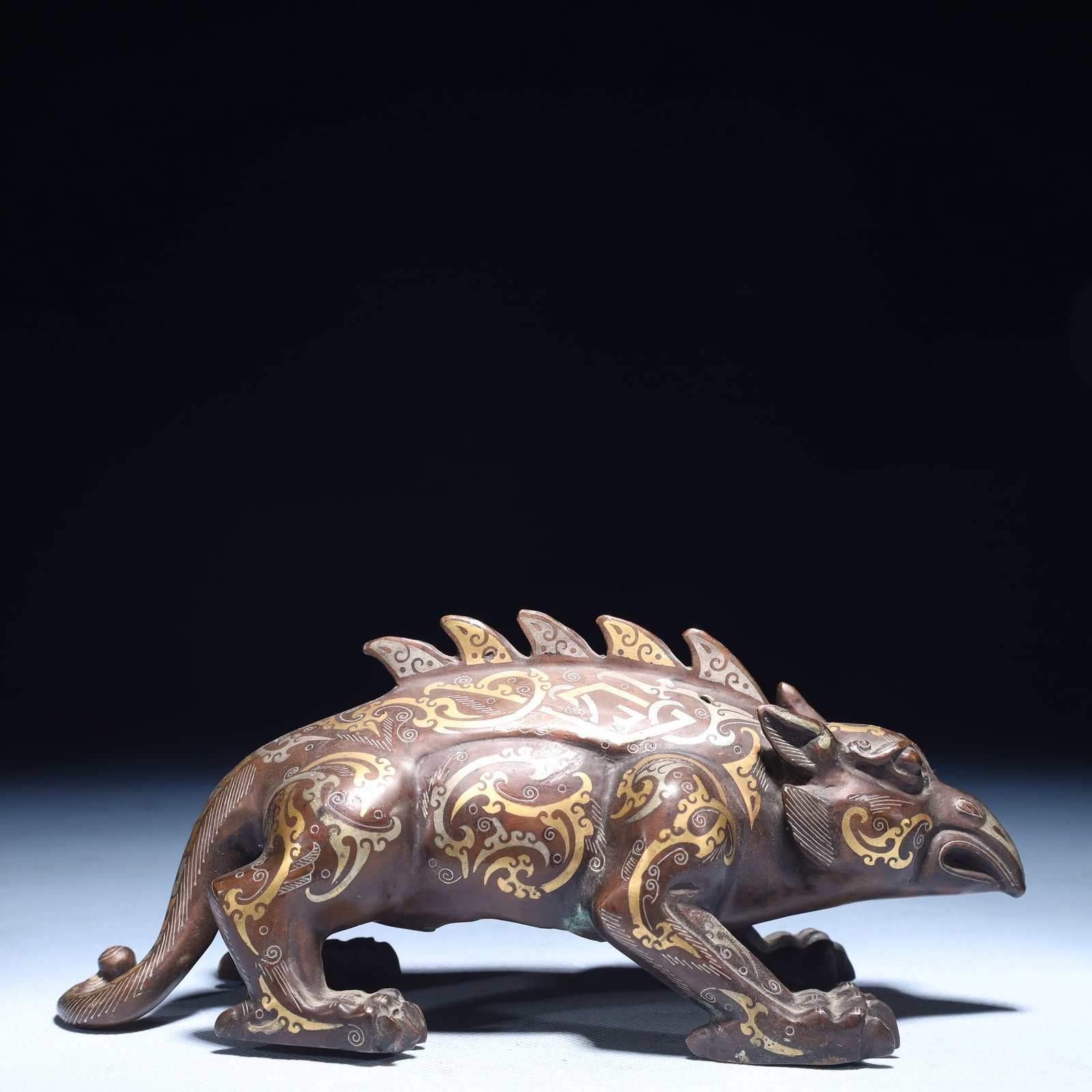 An Exquisite Inlaid Gold and Silver Auspicious Beast Ornament: An Exquisite Inlaid Gold and Silver Auspicious Beast Ornament,Qing Dynasty,China,Size:8.3inx3.5inx3.9in,Weight:800g 错金银瑞兽摆件,中国清