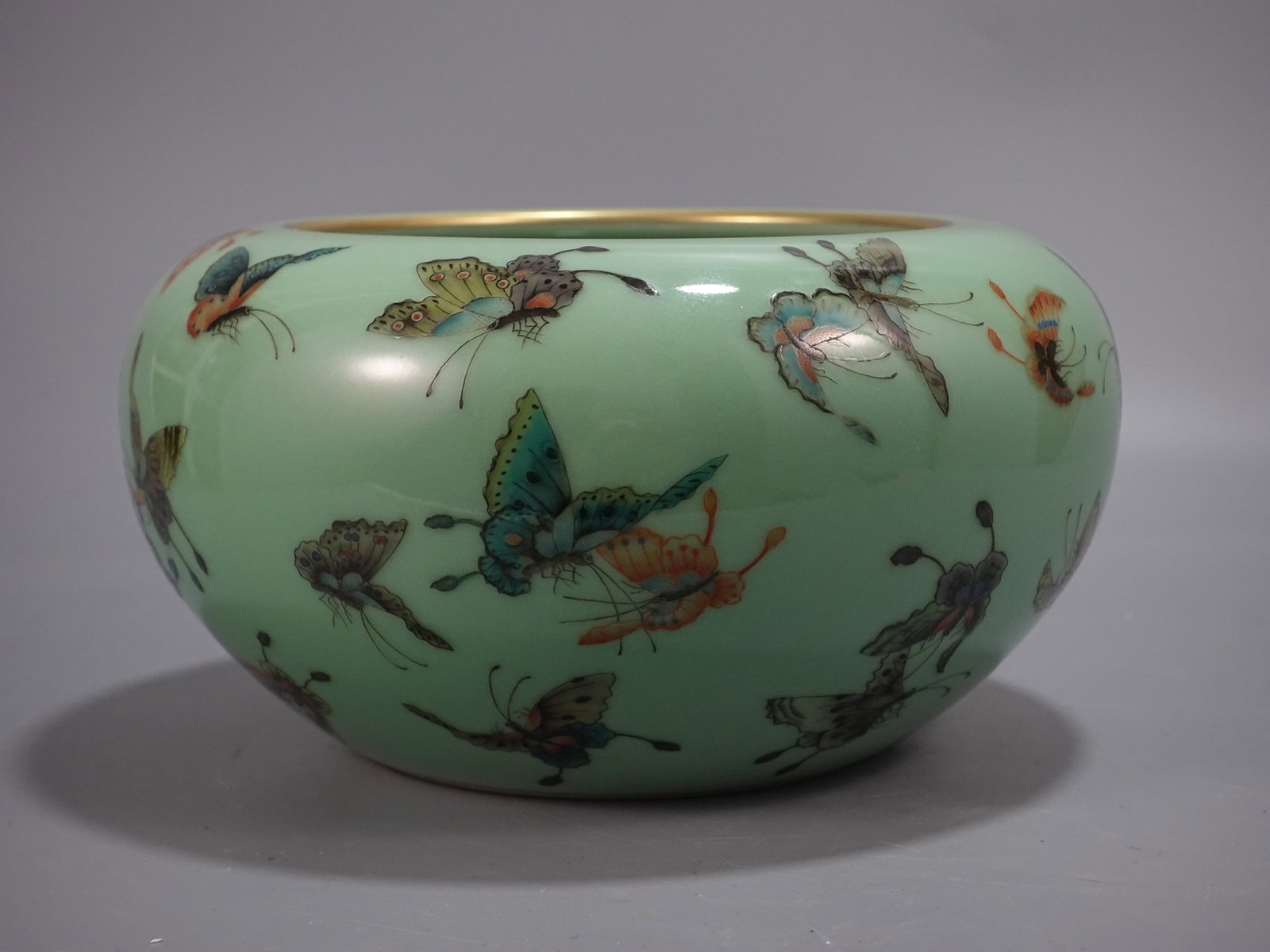 An Exquisite Celadon Glazed Famille-Rose Painted Gold Butterfly Pattern Water Pot: An Exquisite Celadon Glazed Famille-Rose Painted Gold Butterfly Pattern Water Pot,Qing Dynasty,China,Qianlong Six-character Mark,Size:5.3inx9.6in 青釉粉彩描金උ