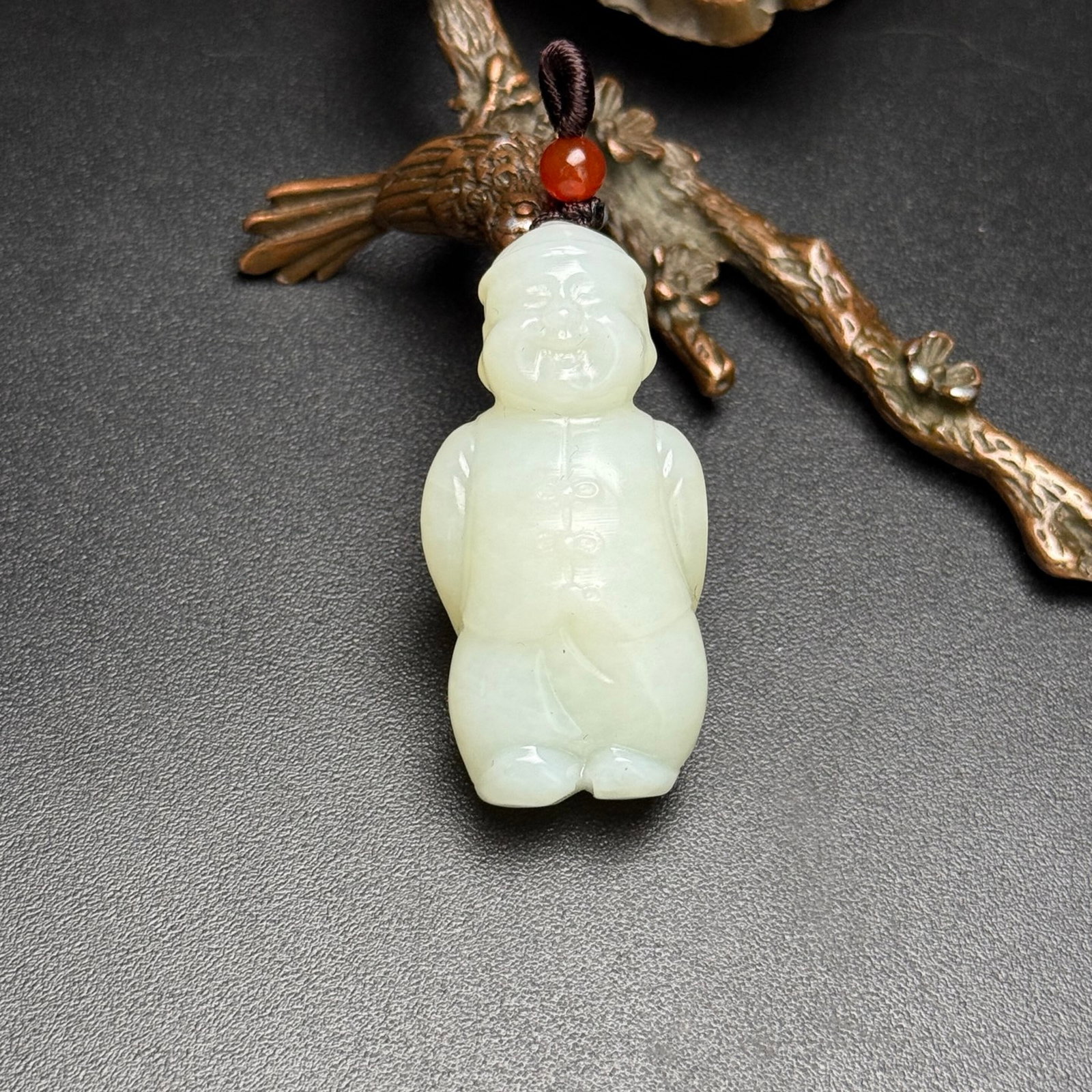 An Exquisite White Jade Figure Pendant: An Exquisite White Jade Figure Pendant,Qing Dynasty,China,Size:45mmx22mmx16mm,Weight:21g 白玉人物挂件,中国清代