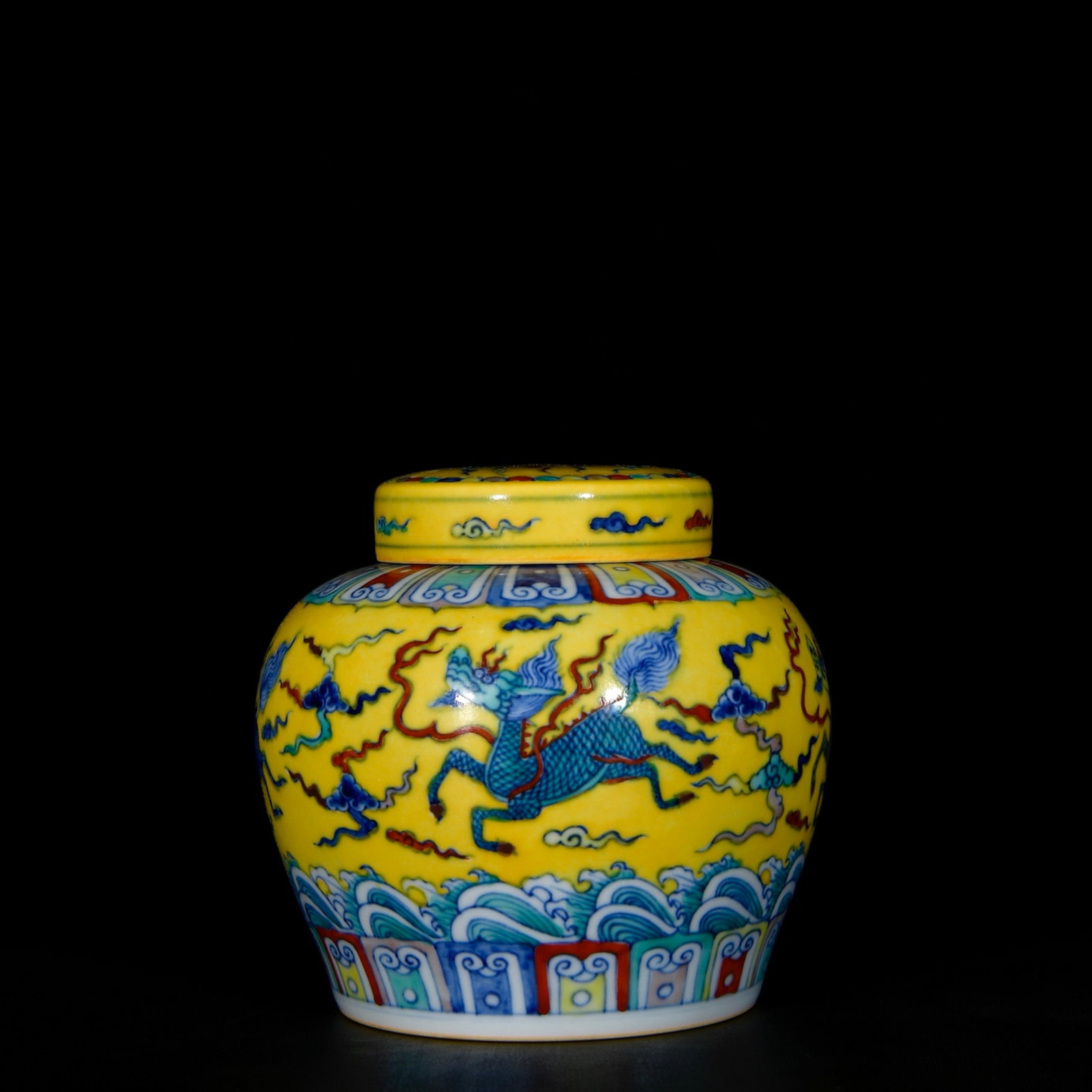 An Exquisite Yellow Ground Doucai Seawater,Auspicious Cloud and Kylin Pattern Jar with Cover: An Exquisite Yellow Ground Doucai Seawater,Auspicious Cloud and Kylin Pattern Jar with Cover,Ming Dynasty, China,Size:5.1inx5.9in 黄地斗彩海水祥云࿛
