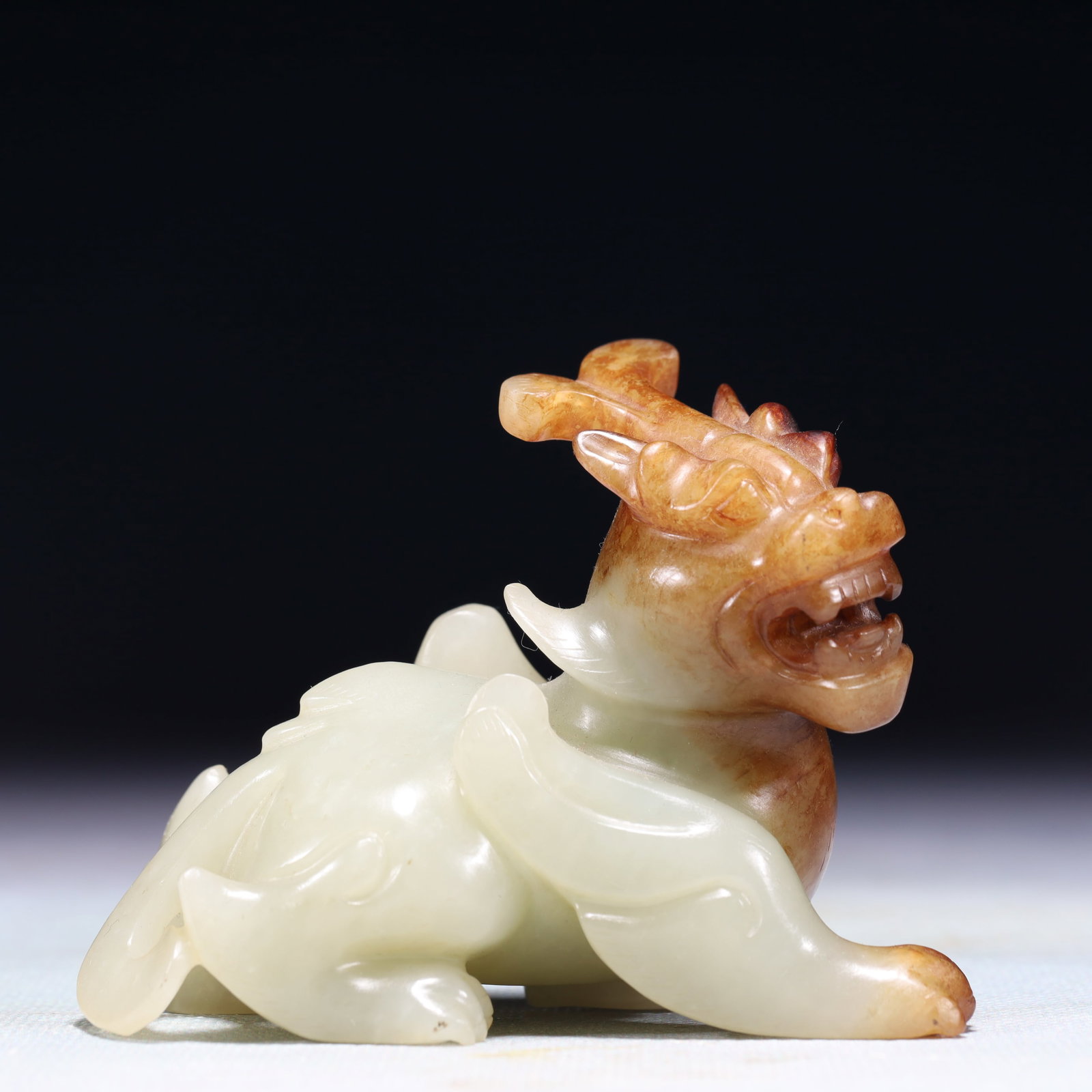 An Exquisite White Jade Auspicious Beast Ornament: An Exquisite White Jade Auspicious Beast Ornament,Qing Dynasty,China,Size:3.5inx1.6inx2.8in,Weight:234g 白玉瑞兽摆件,中国清代