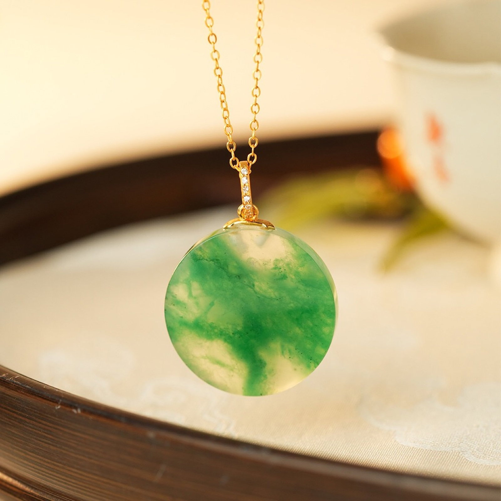 An Exquisite Sterling Silver-Gold Plated Inlaid Jadeite Pendant: An Exquisite Sterling Silver-Gold Plated Inlaid Jadeite Pendant,Size:23.8mm,Weight:5.49g 纯银镀金镶翡翠吊坠