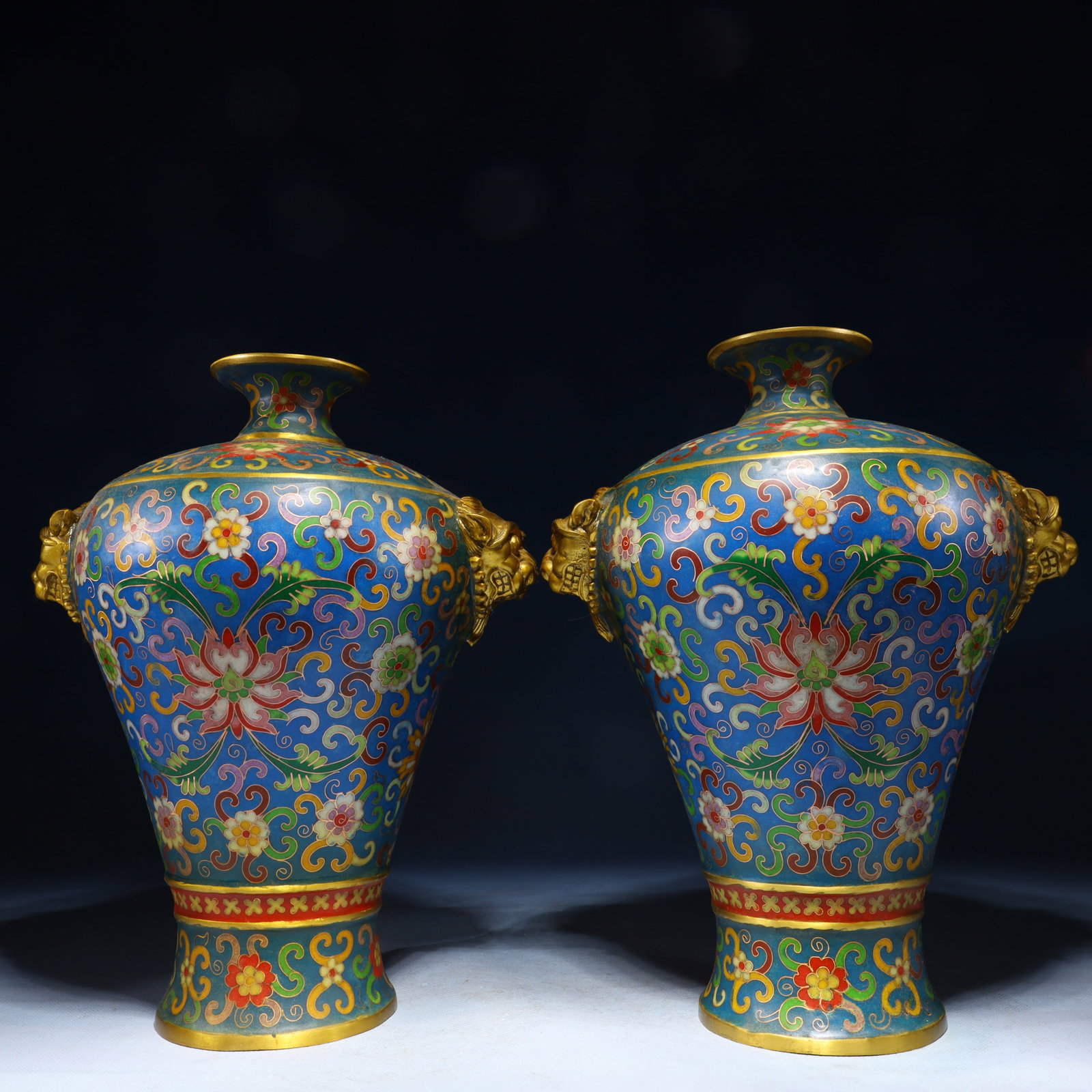 A Pair of Exquisite Cloisonne Lotus Pattern Beast-Ears Vases: A Pair of Exquisite Cloisonne Lotus Pattern Beast-Ears Vases,Qing Dynasty,China,Qianlong Six-character Mark,Size:7.5inx5.5inx11.8in,Weight:5550g 一对景泰蓝缠枝
