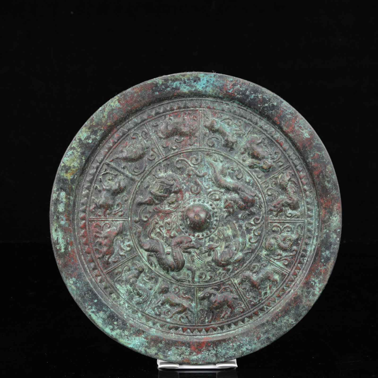 An Archaic Bronze Dragon and Phoenix Pattern Round Mirror: An Archaic Bronze Dragon and Phoenix Pattern Round Mirror,The Warring States period in China,Size:8.5inx0.8in,Weight:1700g 青铜龙凤纹圆镜,中国