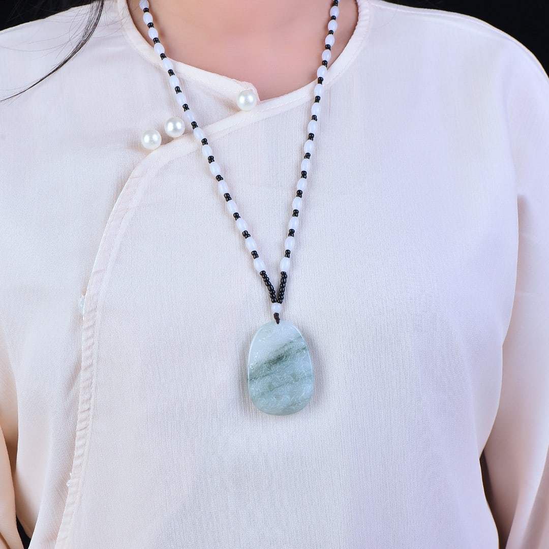 An Exquisite Jadeite Dragon Pattern Pendant (1 of 3)