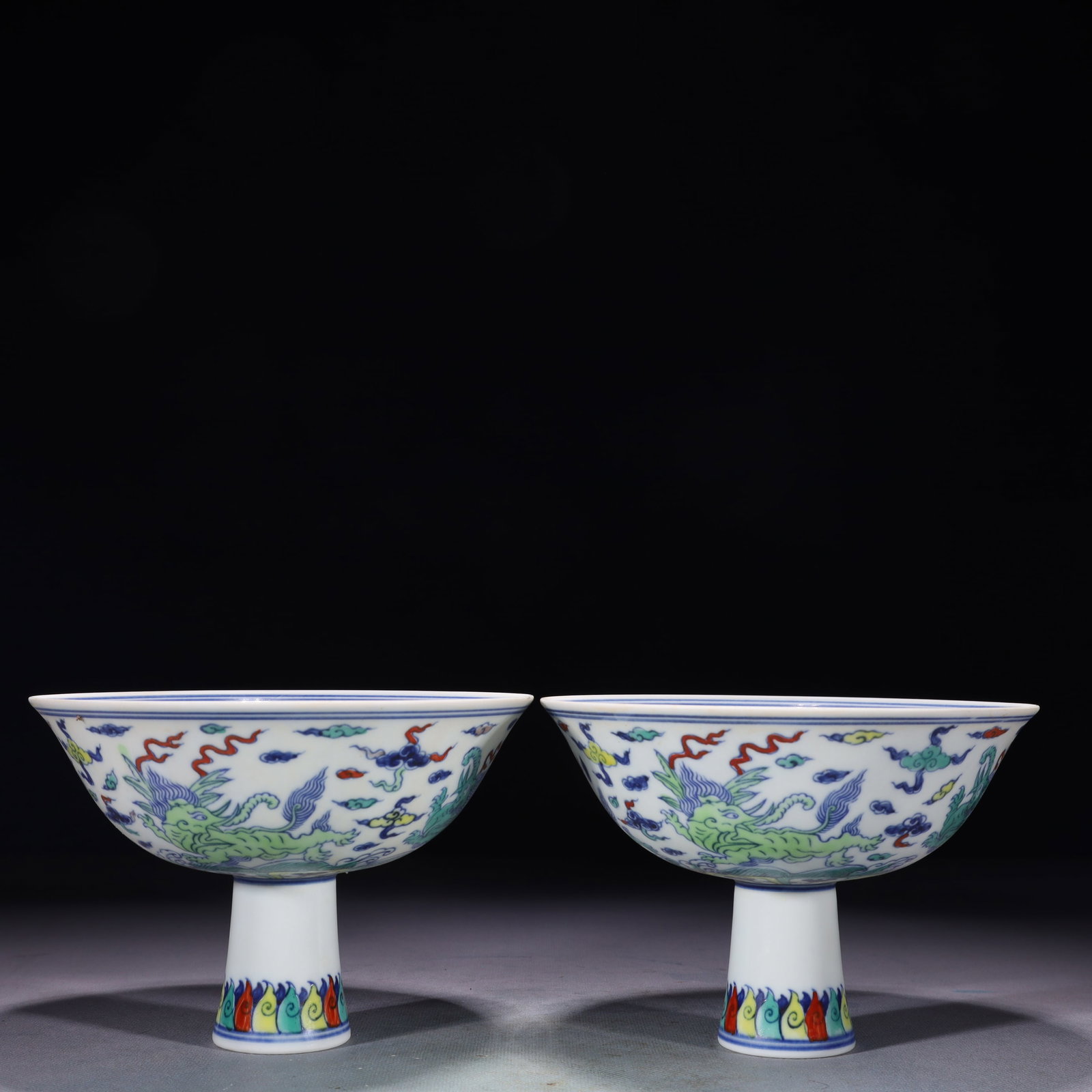 A Pair of Exquisite Doucai Seawater and Beast Pattern Stem Bowls: A Pair of Exquisite Doucai Seawater and Beast Pattern Stem Bowls,Ming Dynasty,China,Chenghua Six-character Mark,Size:6.5inx4.5in,Weight:600g 一对斗彩海水兽