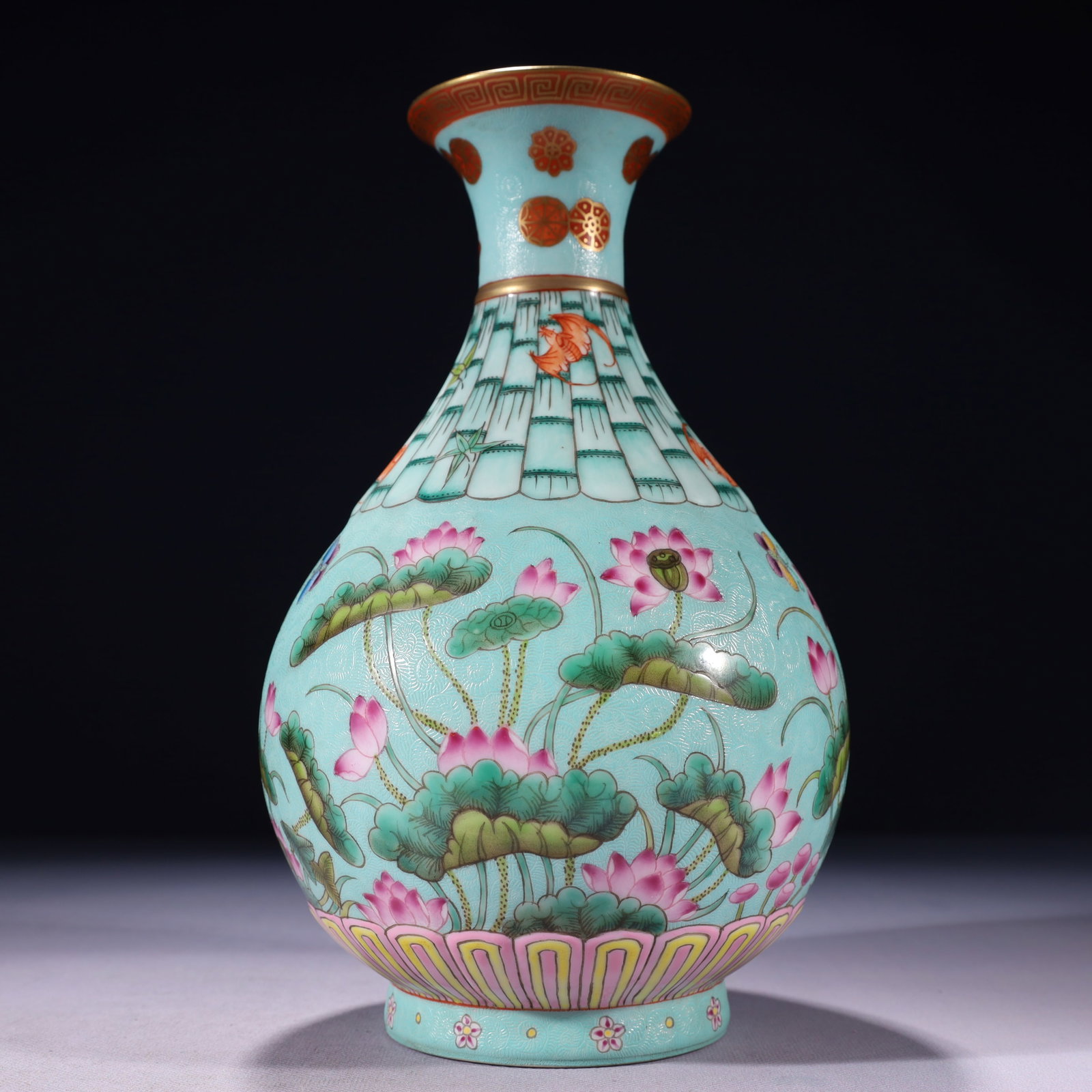 An Exquisite Turquoise Glazed Famille-Rose Painted Gold Lotus Pattern Vase: An Exquisite Turquoise Glazed Famille-Rose Painted Gold Lotus Pattern Vase,Qing Dynasty,China,Qianlong Six-character Mark,Size:5.9inx10.4in,Weight:1250g 松石绿釉粉彩