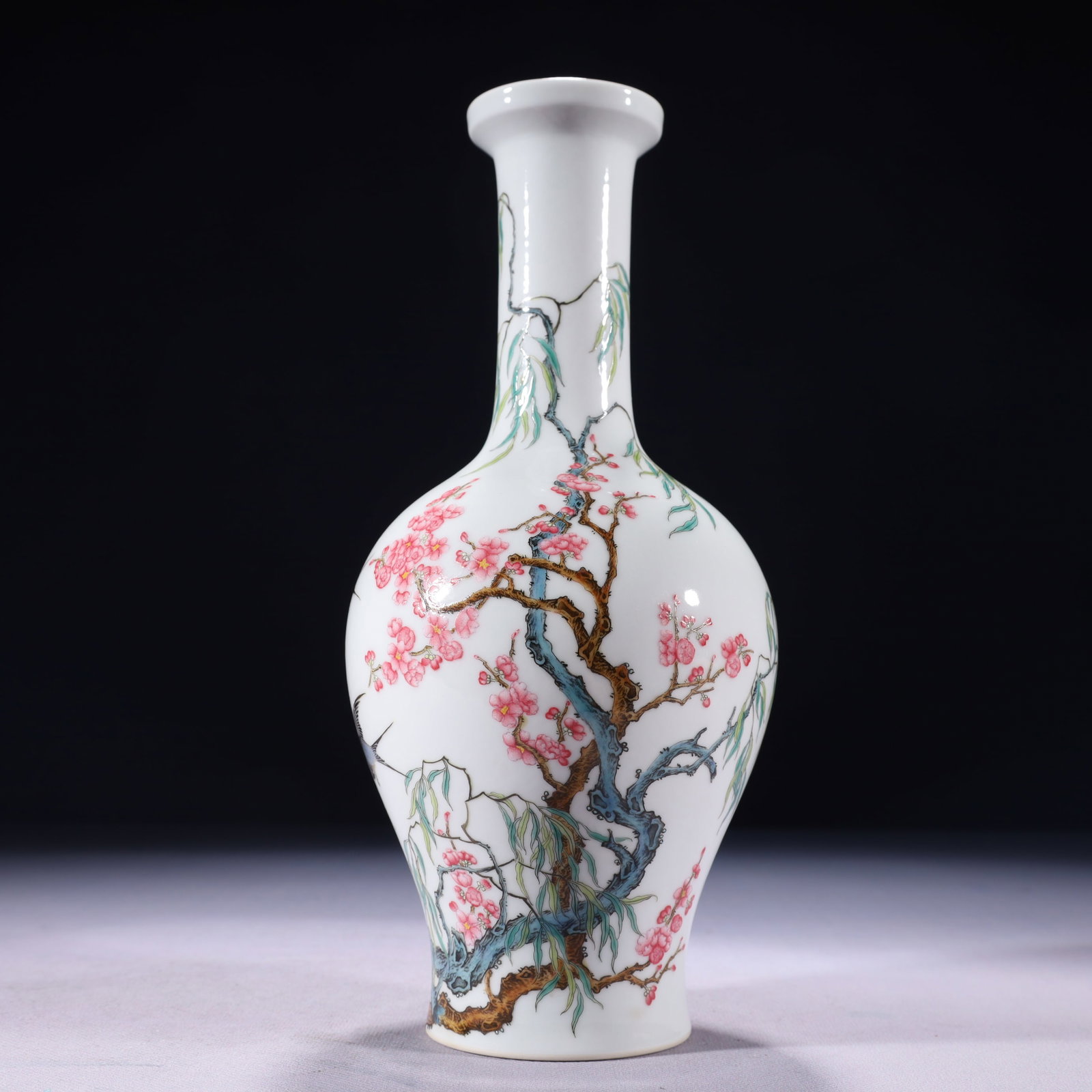 An Exquisite Famille-Rose Flower and Bird Pattern Vase: An Exquisite Famille-Rose Flower and Bird Pattern Vase,Qing Dynasty,China,Qianlong Four-character Mark,Size:4.3inx10.2in,Weight:600g 粉彩花鸟纹瓶,中国&#