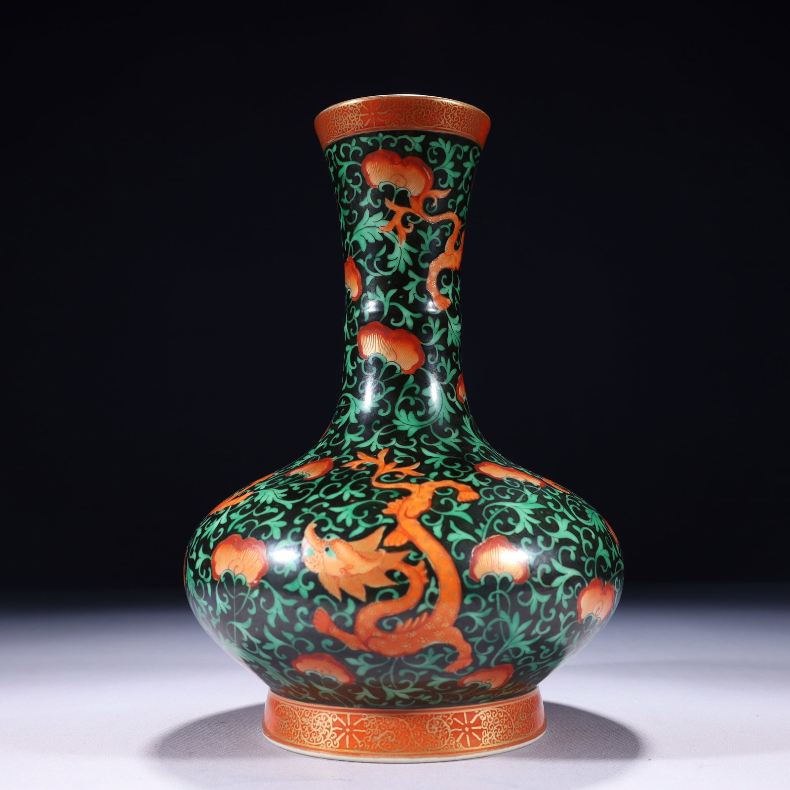 An Exquisite Black Ground Iron-Red Painted Gold Lotus and Dragon Pattern Vase: An Exquisite Black Ground Iron-Red Painted Gold Lotus and Dragon Pattern Vase,Qing Dynasty,China,Yongzheng Six-character Mark,Size:6.3inx9.8in,Weight:1250g 黑地矾红描%