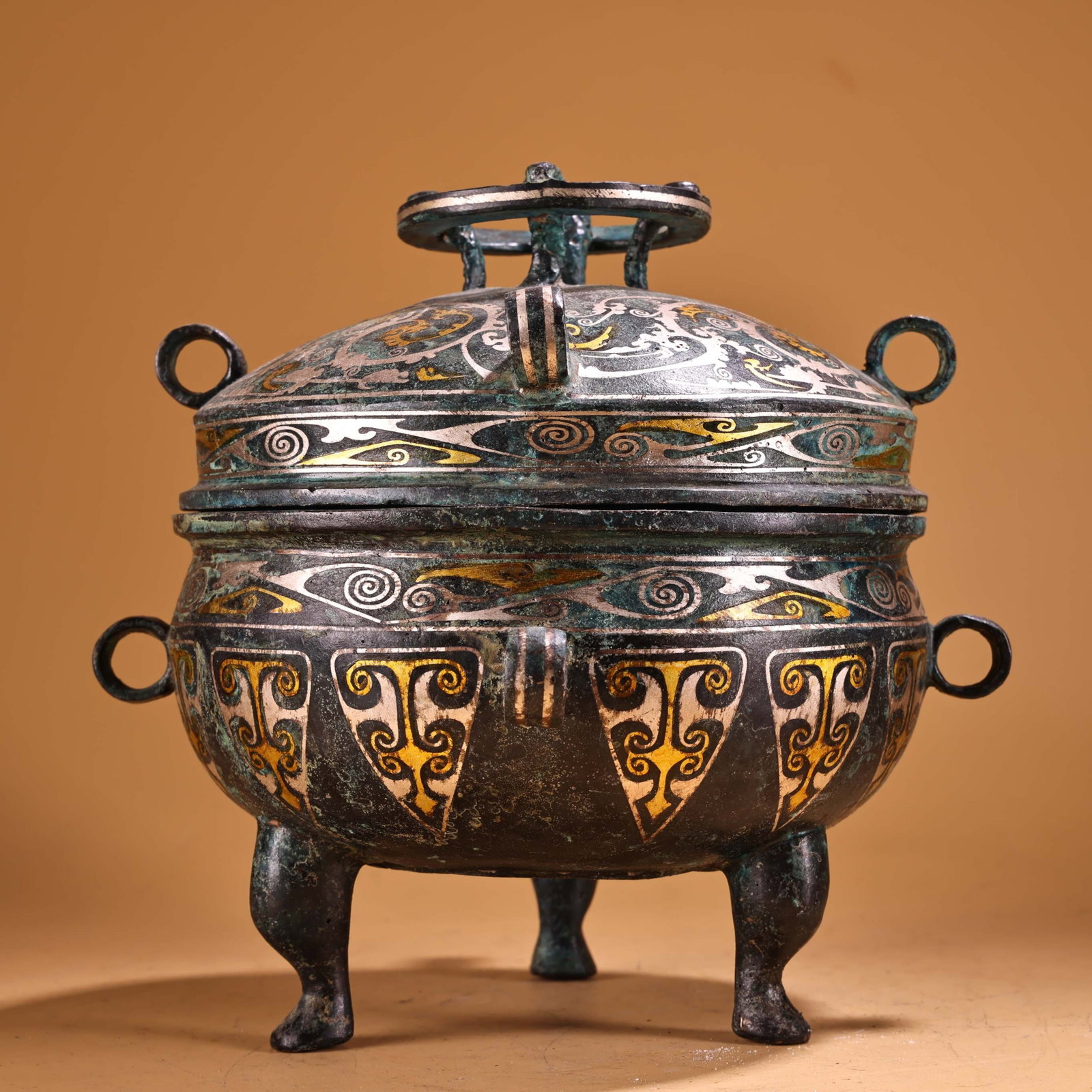 An Exquisite Bronze Inlaid Gold and Silver Tripod Jar with Cover,With Inscription: An Exquisite Bronze Inlaid Gold and Silver Tripod Jar with Cover,With Inscription,the Warring States period in China,Size:7.9inx6.7in,Weight:1950g 青铜错金银三Ū