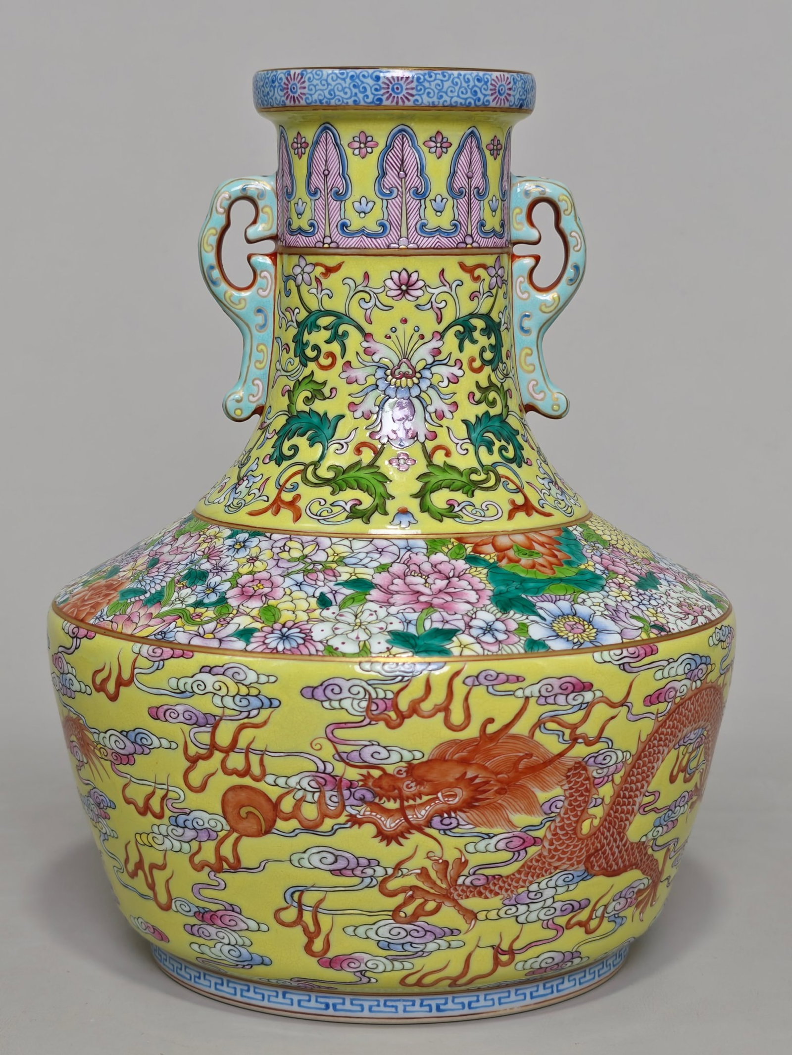An Exquisite Yellow Ground Famille-Rose Auspicious Cloud and Dragon Pattern Double-Ears Vase: An Exquisite Yellow Ground Famille-Rose Auspicious Cloud and Dragon Pattern Double-Ears Vase,Qing Dynasty,China,Qianlong Six-character Mark,Size:10.2inx8.3in 黄地粉彩祥&#