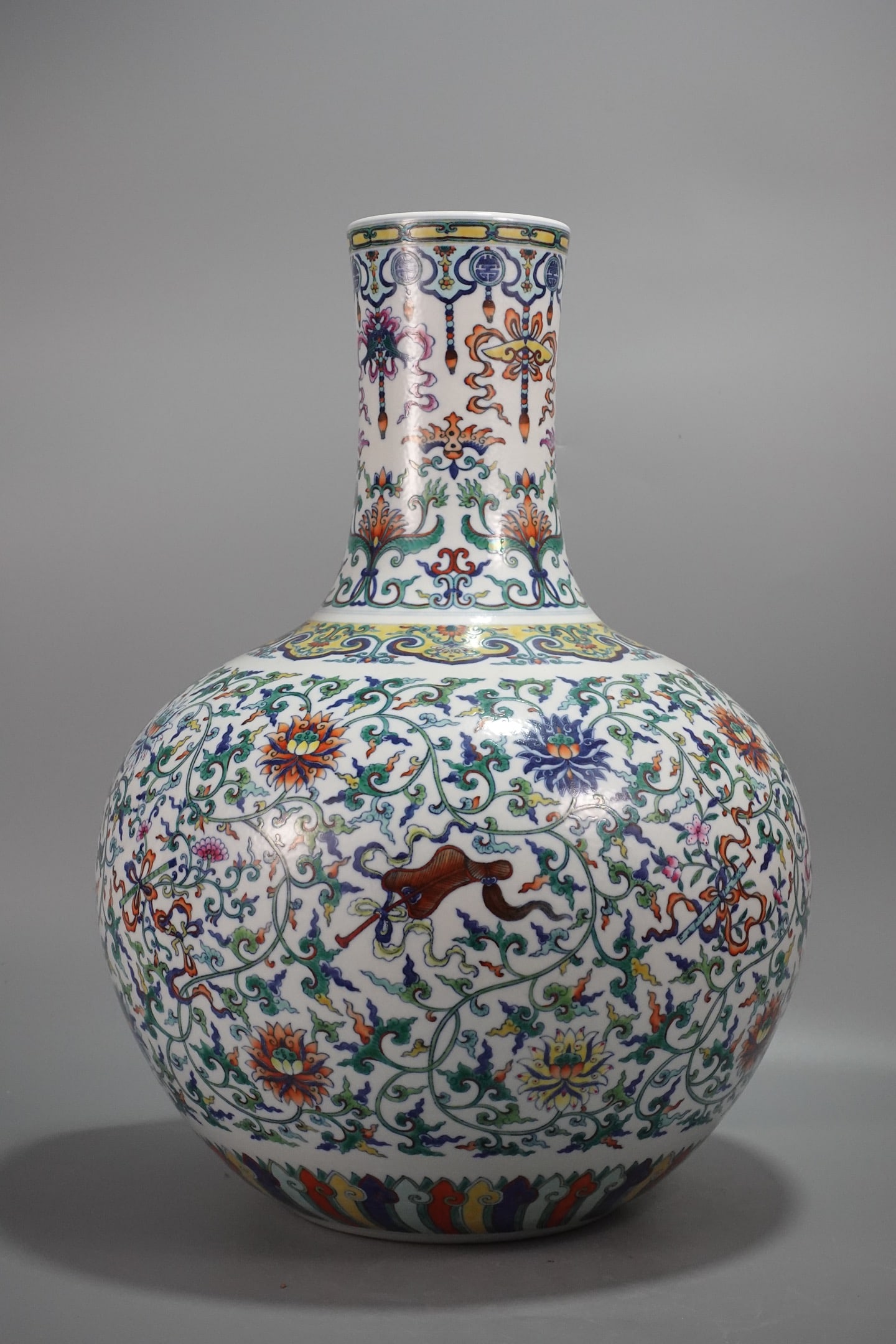 A Huge Blue and White Doucai Lotus and Eight Treasures Pattern Vase: A Huge Blue and White Doucai Lotus and Eight Treasures Pattern Vase,Qing Dynasty,China,Qianlong Six-character Mark,Size:20.9inx15.7in 青花斗彩缠枝莲八&#