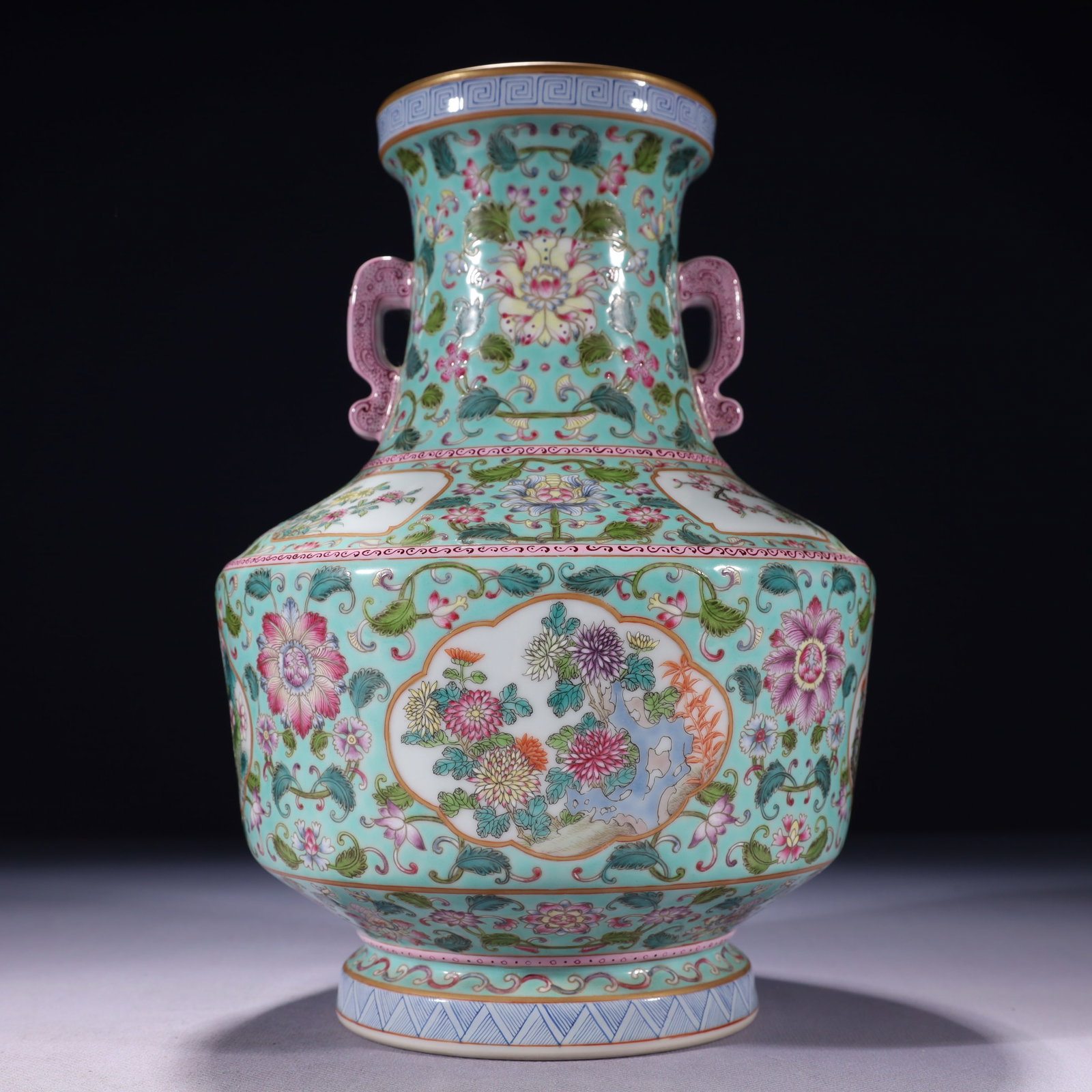 An Exquisite Turquoise Glazed Famille-Rose Painted Gold Flower Pattern Double-Ears Vase: An Exquisite Turquoise Glazed Famille-Rose Painted Gold Flower Pattern Double-Ears Vase,Qing Dynasty,China,Qianlong Six-character Mark,Size:7.1inx11in,Weight:2150g 松石绿釉