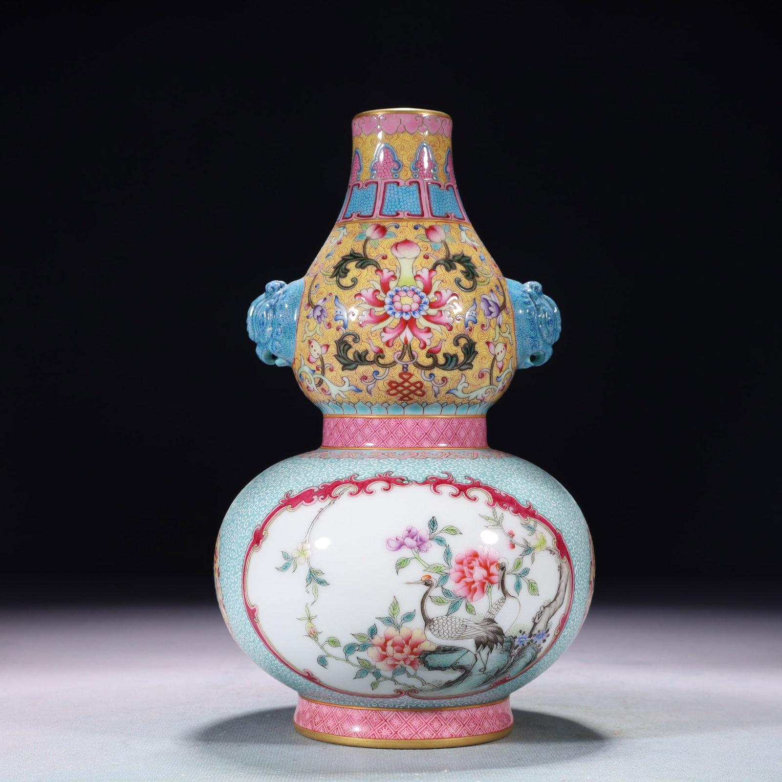 An Exquisite Turquoise Glazed Famille-Rose Painted Gold Lotus Pattern Beast-Ears Vase: An Exquisite Turquoise Glazed Famille-Rose Painted Gold Lotus Pattern Beast-Ears Vase,Qing Dynasty,China,Qianlong Four-character Mark,Size:4.7inx9.1in,Weight:1200g 松石绿釉