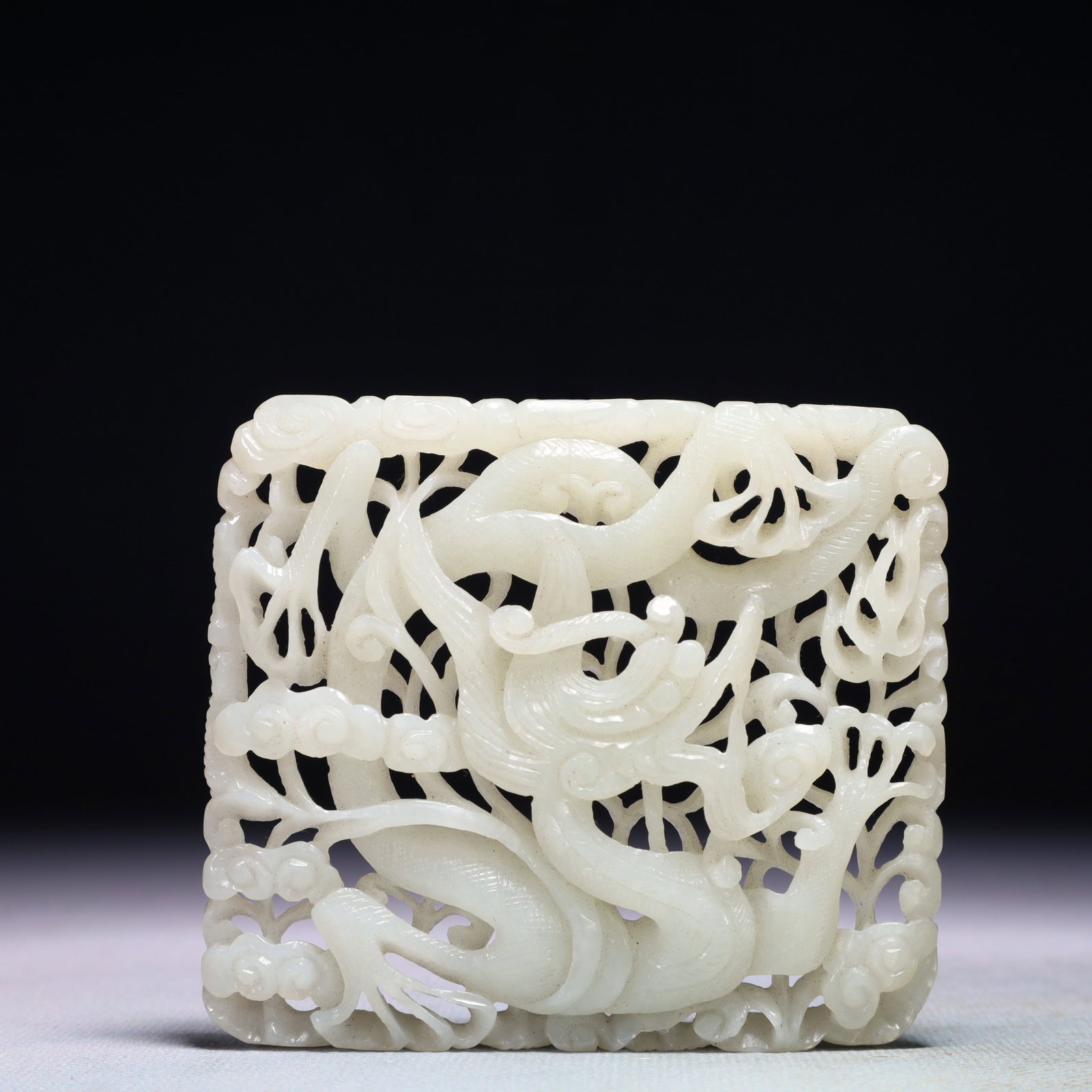 An Exquisite White Jade Auspicious Cloud and Dragon Pattern Pendant: An Exquisite White Jade Auspicious Cloud and Dragon Pattern Pendant,Qing Dynasty,China,Size:3.5inx3in,Weight:95.2g 白玉祥云龙纹佩,中国清
