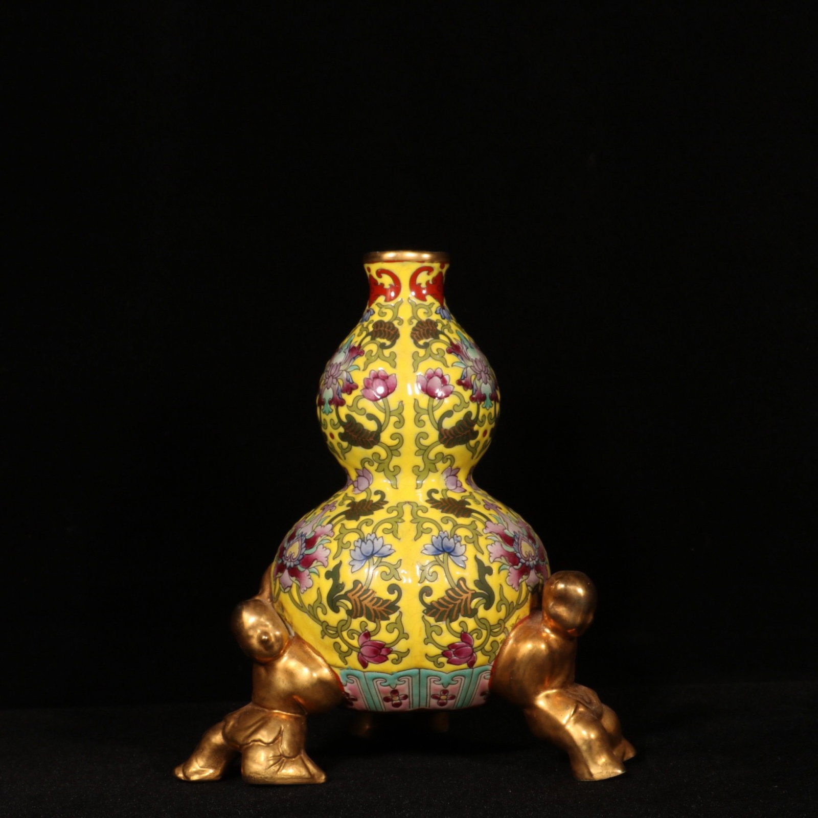 An Exquisite Enamel Painted Gold Lotus Pattern Tripod Gourd-Shaped Vase: An Exquisite Enamel Painted Gold Lotus Pattern Tripod Gourd-Shaped Vase,Qing Dynasty,China,Yongzheng Four-character Mark,Size:6.1inx4.3in 珐琅彩描金缠枝ഫ
