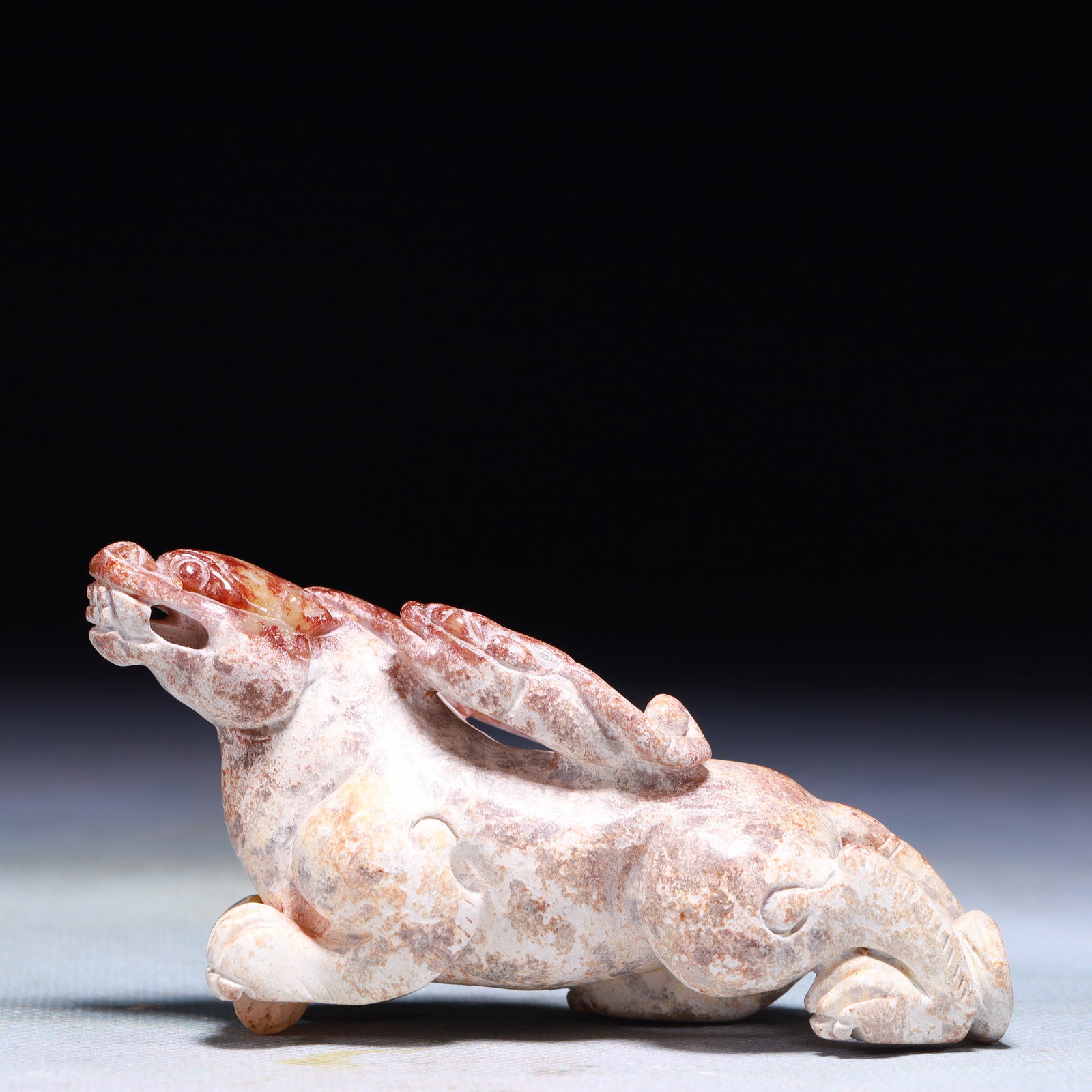 An Exquisite Archaic Jade Auspicious Beast Ornament: An Exquisite Archaic Jade Auspicious Beast Ornament,Ancient Time,China,Size:3inx1.4inx3in,Weight:289g 高古玉瑞兽摆件中国远古时&#
