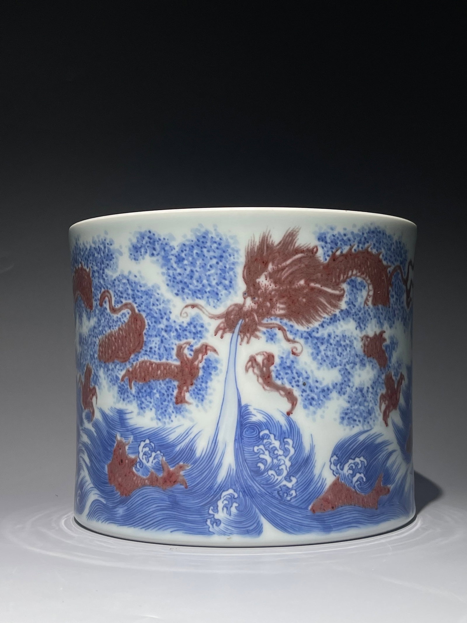 An Exquisite Blue and White Underglaze-Red Seawater and Dragon Pattern Brush Pot: An Exquisite Blue and White Underglaze-Red Seawater and Dragon Pattern Brush Pot,Qing Dynasty,China,Kangxi Six-character Mark,Size:6.3inx7.5in 青花釉里红海水&