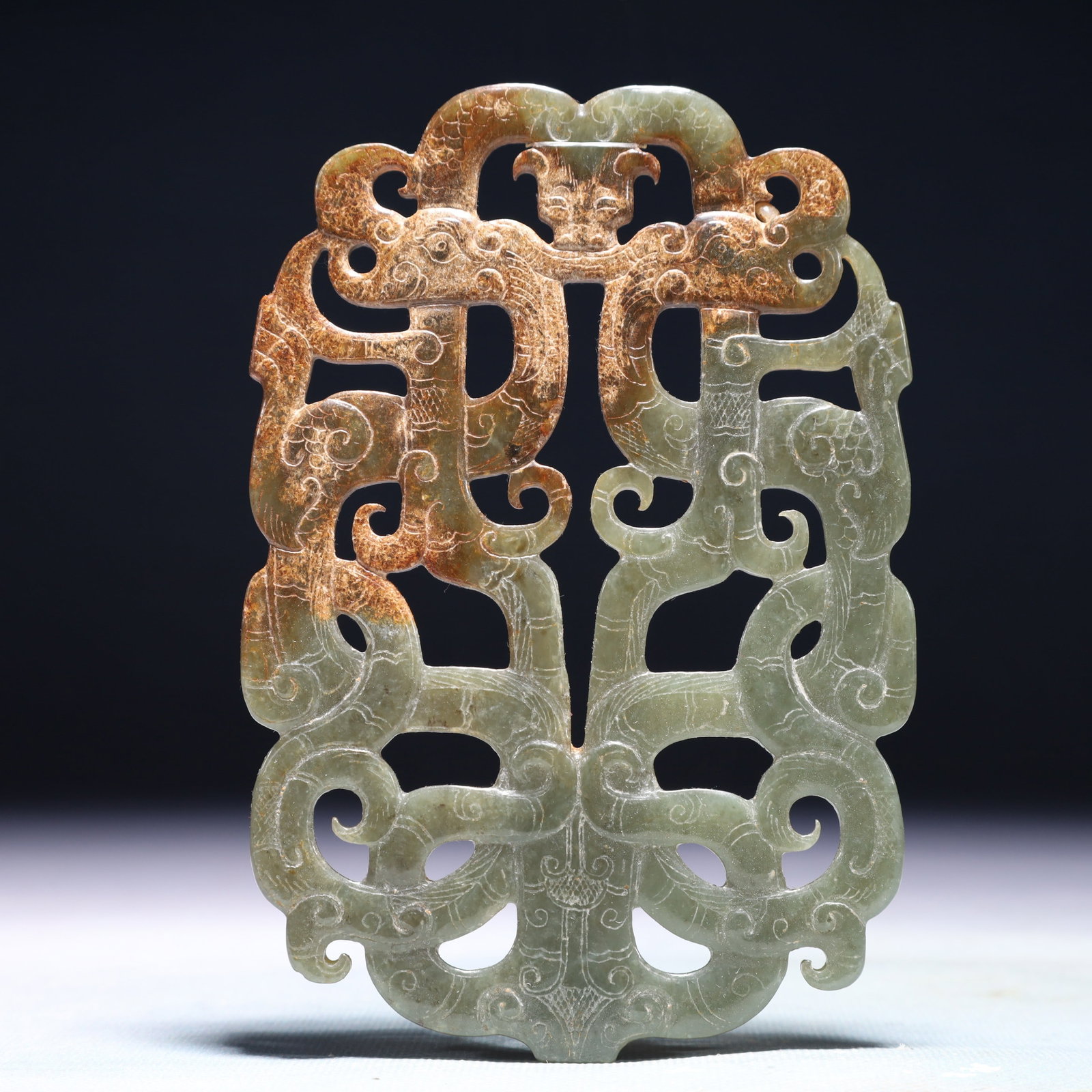 An Exquisite Green Jade Dragon Pattern Pendant: An Exquisite Green Jade Dragon Pattern Pendant,Qing Dynasty,China,Size:3.7inx5.3in,Weight:133.3g 青玉龙纹挂件,中国清代