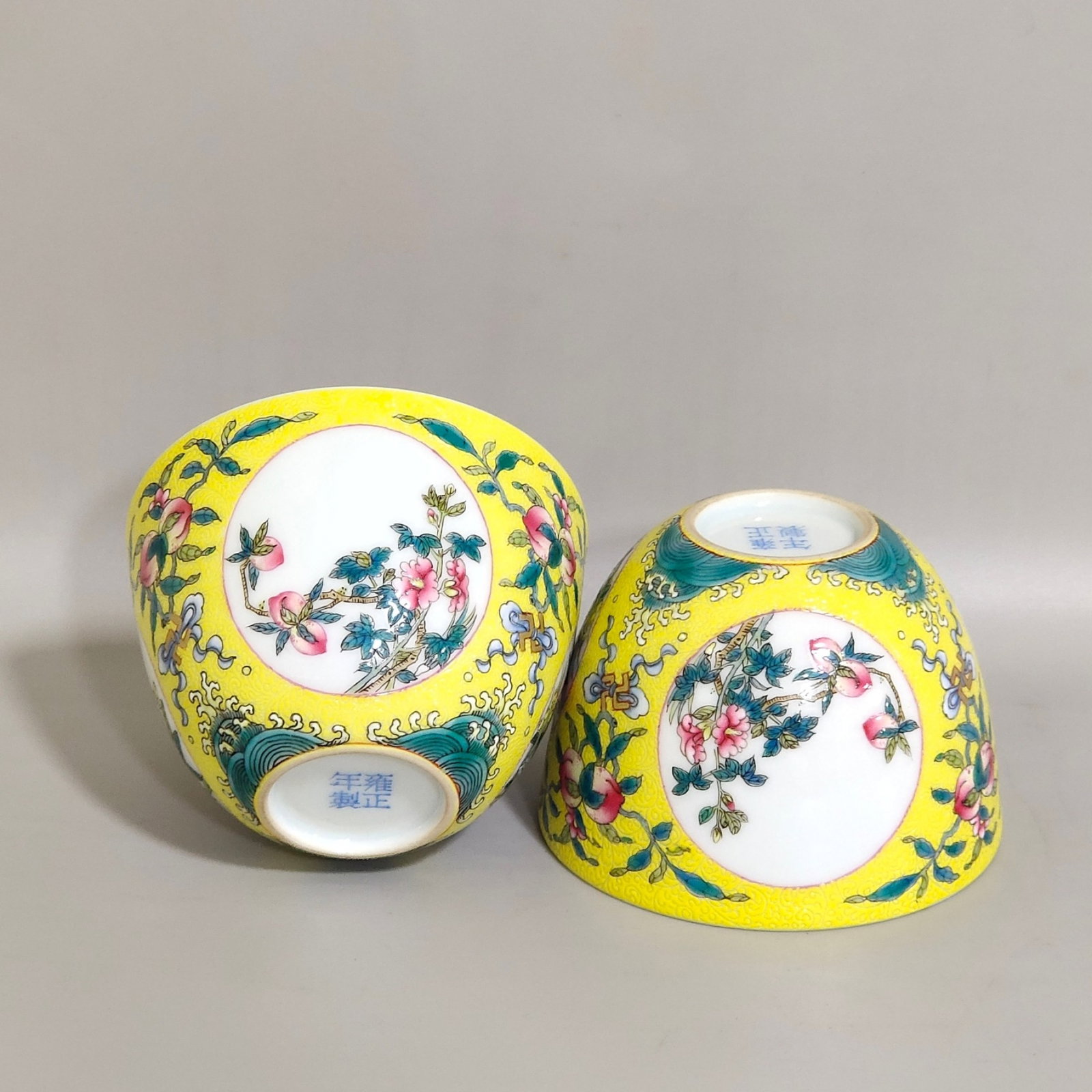 A Pair of Exquisite Yellow Ground Famille-Rose Flower Pattern Cups: A Pair of Exquisite Yellow Ground Famille-Rose Flower Pattern Cups,Qing Dynasty,China,Yongzheng Four-character Mark,Size:2inx2.8in 一对黄地粉彩花卉ń