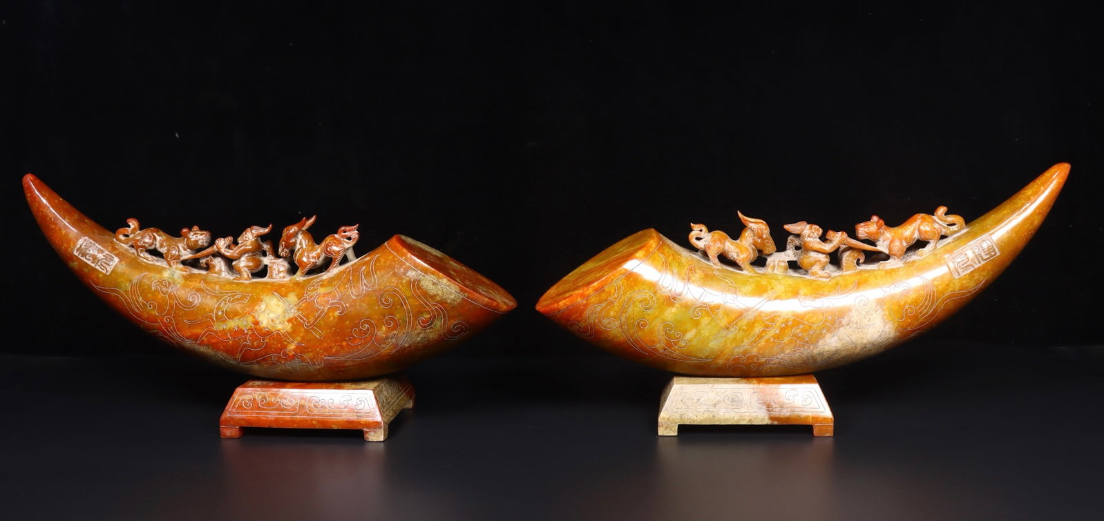 A Pair of Exquisite Archaic Jade Beast Pattern Ivory Ornaments: A Pair of Exquisite Archaic Jade Beast Pattern Ivory Ornaments,Ancient Time,China,Size:(Ornament)13.8inx2.8inx5.1in,(Base)4.1inx3.7inx1.4in,Weight:8094g 一对高古玉兽