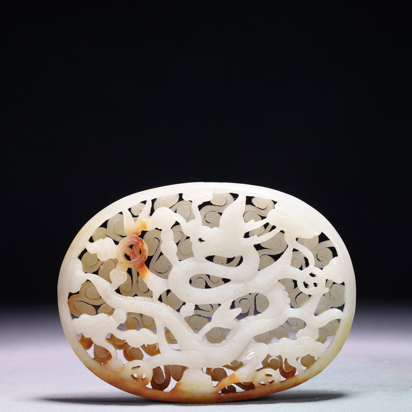 An Exquisite White Jade Auspicious Cloud and Dragon Pattern Pendant: An Exquisite White Jade Auspicious Cloud and Dragon Pattern Pendant,Qing Dynasty,China,Size:4.3inx3.1in,Weight:139.1g 白玉祥云龙纹佩,中国清&
