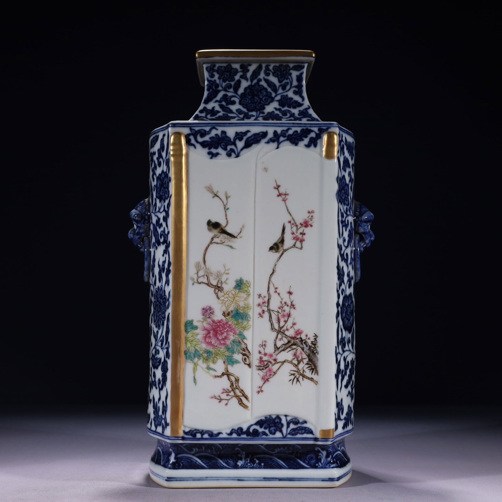 An Exquisite Blue and White Famille-Rose Painted Gold Flower and Bird Pattern Beast-Ears Vase: An Exquisite Blue and White Famille-Rose Painted Gold Flower and Bird Pattern Beast-Ears Vase,Qing Dynasty,China,Qianlong Six-character Mark,Size:7.5inx5.5inx13.4in,Weight:4050g 青花౴