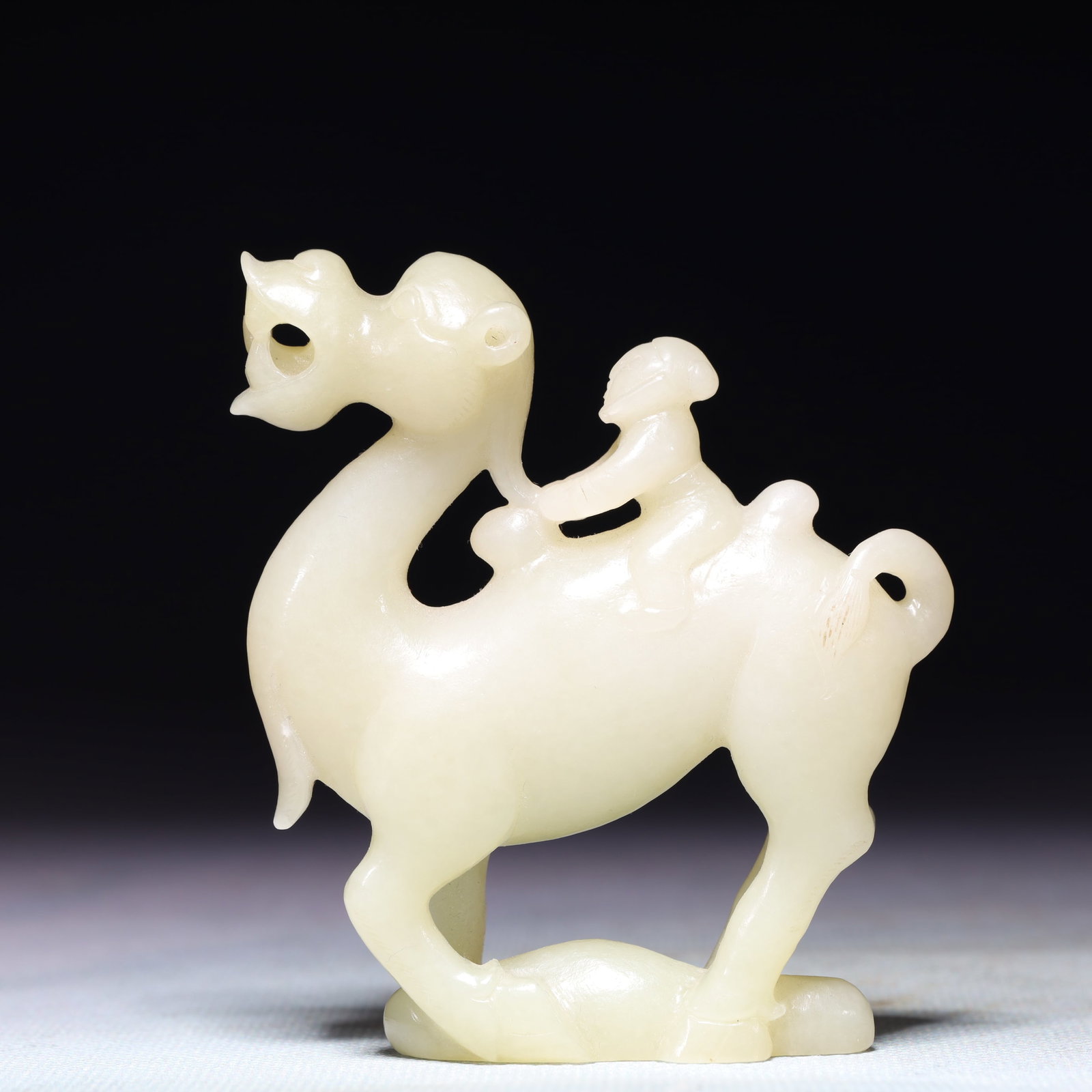 An Exquisite White Jade Camel Ornament: An Exquisite White Jade Camel Ornament,Qing Dynasty,China,Size:2.8inx0.6inx3.1in,Weight:124.9g 白玉骆驼摆件,中国清代