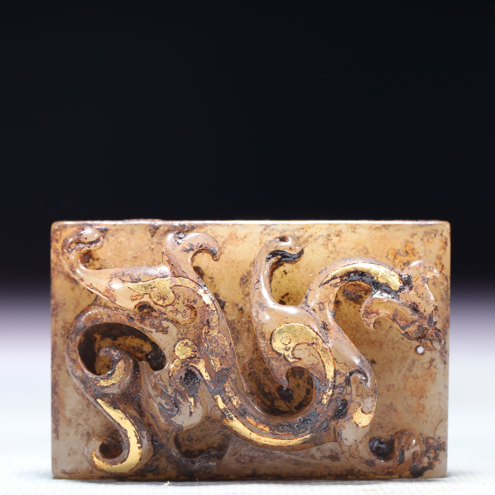 An Exquisite White Jade Inlaid Gold and Silver Dragon Pattern Ornament: An Exquisite White Jade Inlaid Gold and Silver Dragon Pattern Ornament,Qing Dynasty,China,Size:2inx1.3inx0.6in,Weight:62.9g 白玉错金银龙纹摆件,