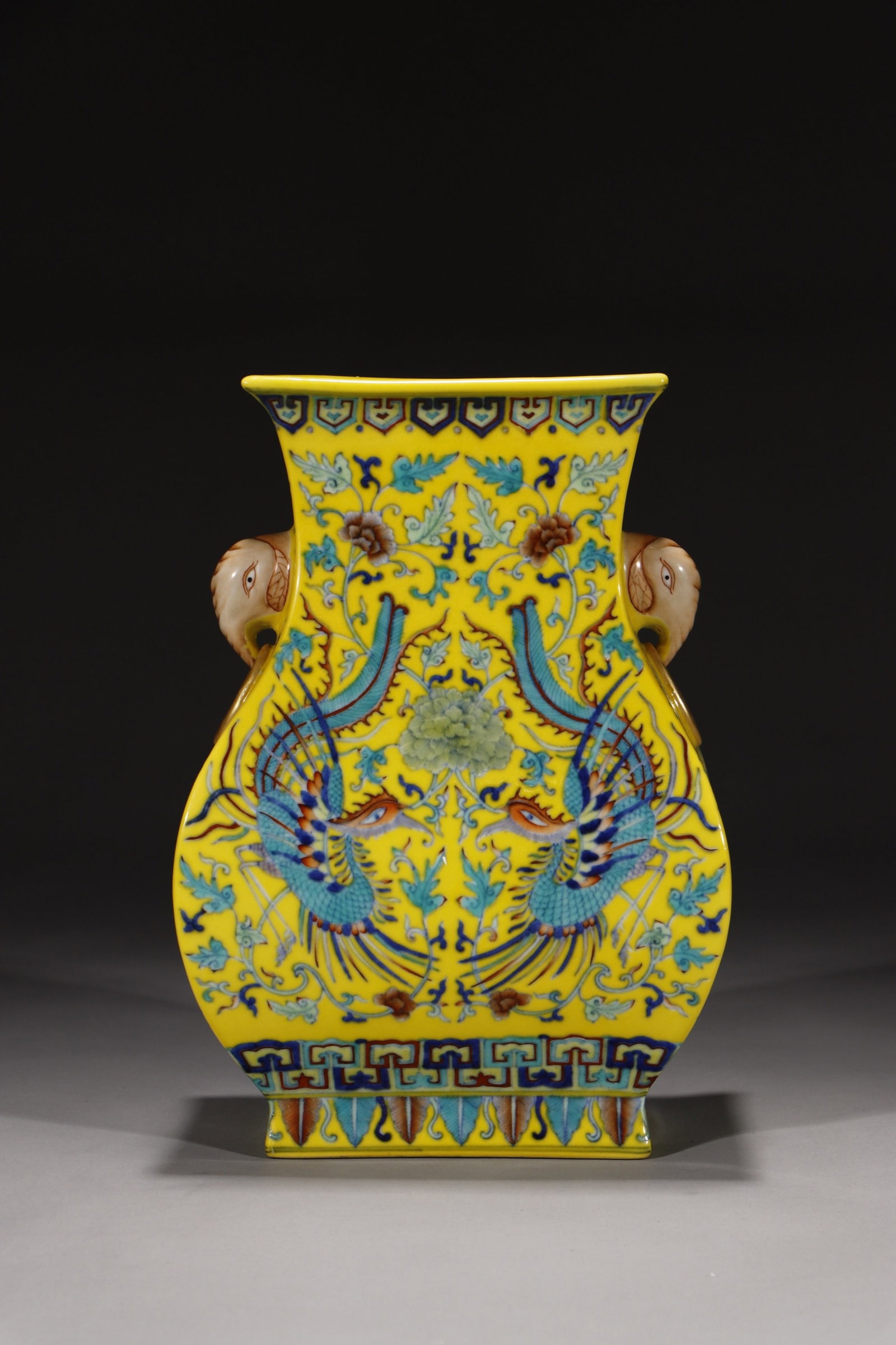 An Exquisite Yellow Ground Doucai Lotus and Phoenix Pattern Elephant-Ears Vase: An Exquisite Yellow Ground Doucai Lotus and Phoenix Pattern Elephant-Ears Vase,Qing Dynasty,China,Qianlong Six-character Mark,Size:10.6in 黄地斗彩缠枝莲࠰