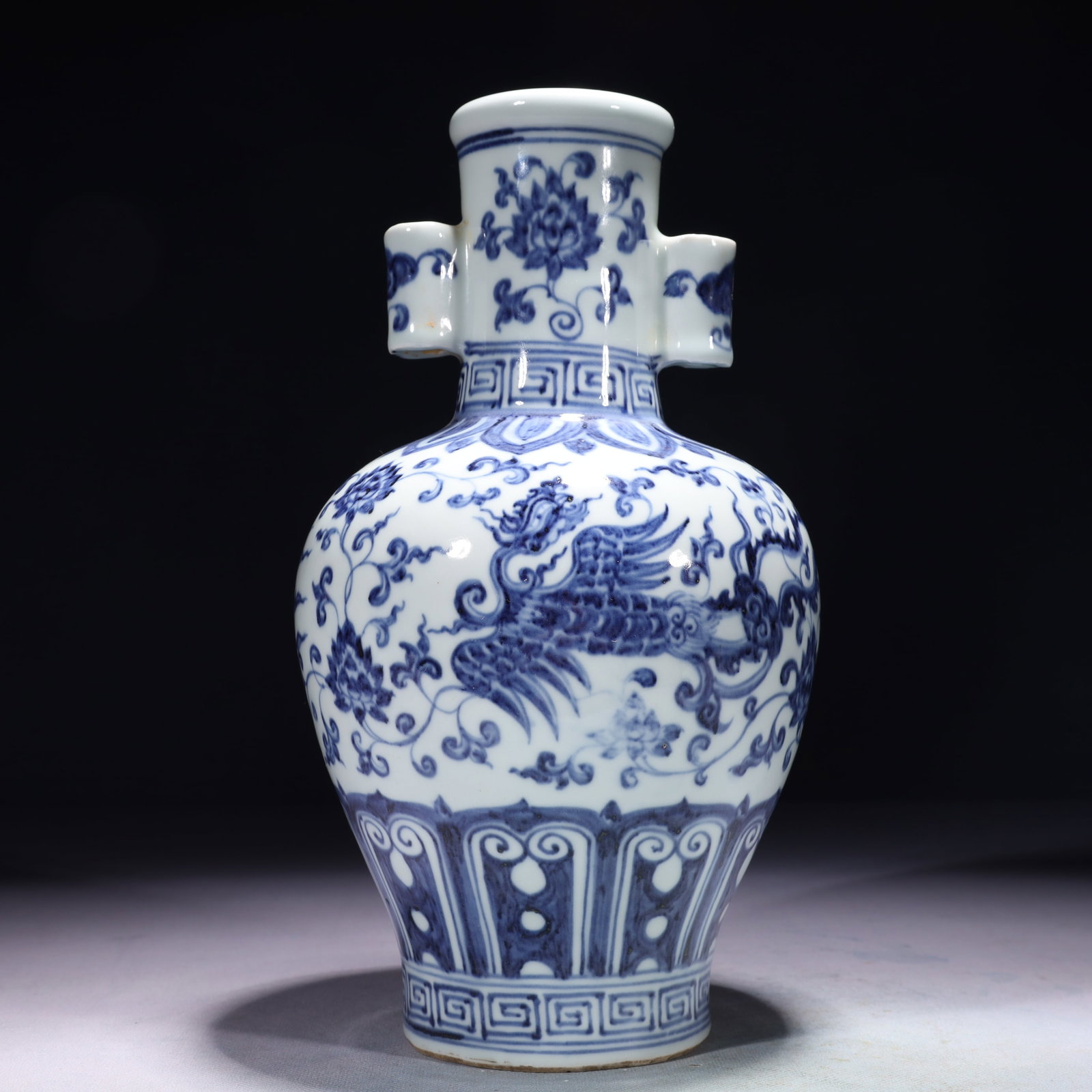 An Exquisite Blue and White Lotus and Phoenix Pattern Double-Ears Vase: An Exquisite Blue and White Lotus and Phoenix Pattern Double-Ears Vase,Ming Dynasty,China,Xuande Six-character Mark,Size:5.9inx11.4in,Weight:1650g 青花缠枝莲凤ń