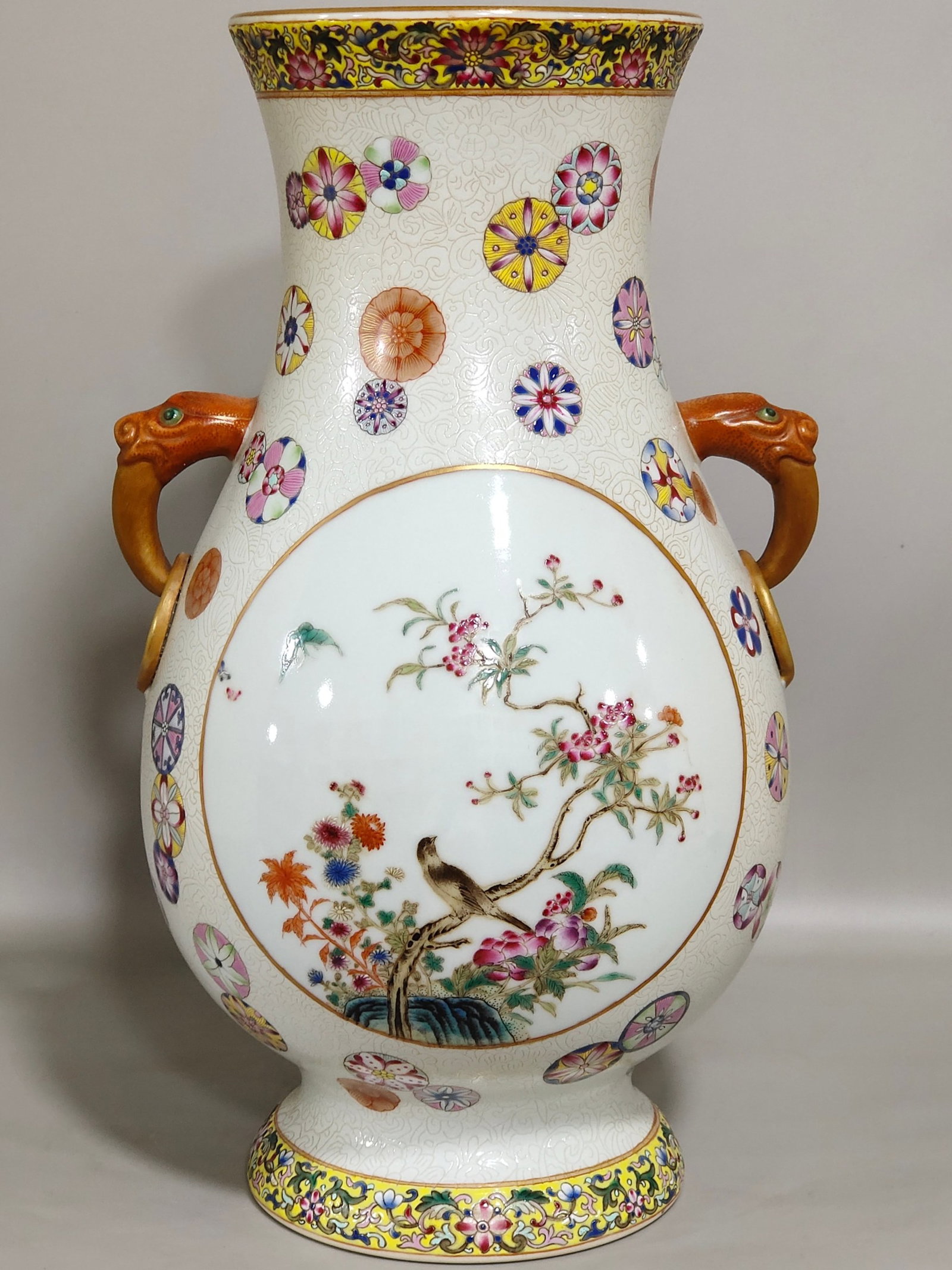 A Rare Yellow Ground Famille-Rose Painted Gold Flower and Bird Pattern Double-Ears Vase: A Rare Yellow Ground Famille-Rose Painted Gold Flower and Bird Pattern Double-Ears Vase,Qing Dynasty,China,Qianlong Six-character Mark,Size:11.8inx6.7in 黄地粉彩描金