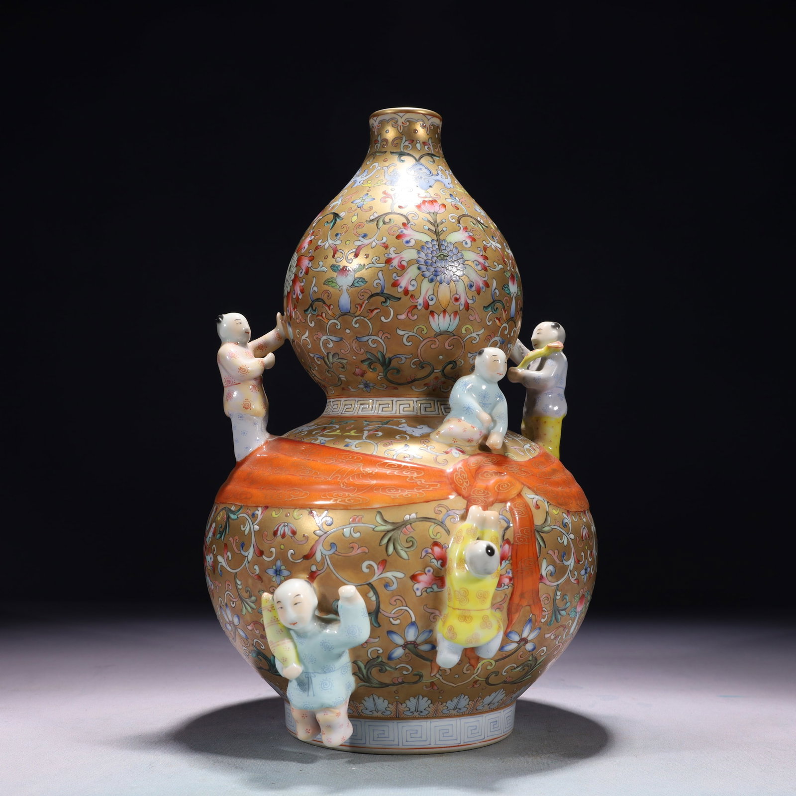 An Exquisite Gold Ground Famille-Rose Lotus and Figure Pattern Gourd-Shaped Vase (1 of 12)