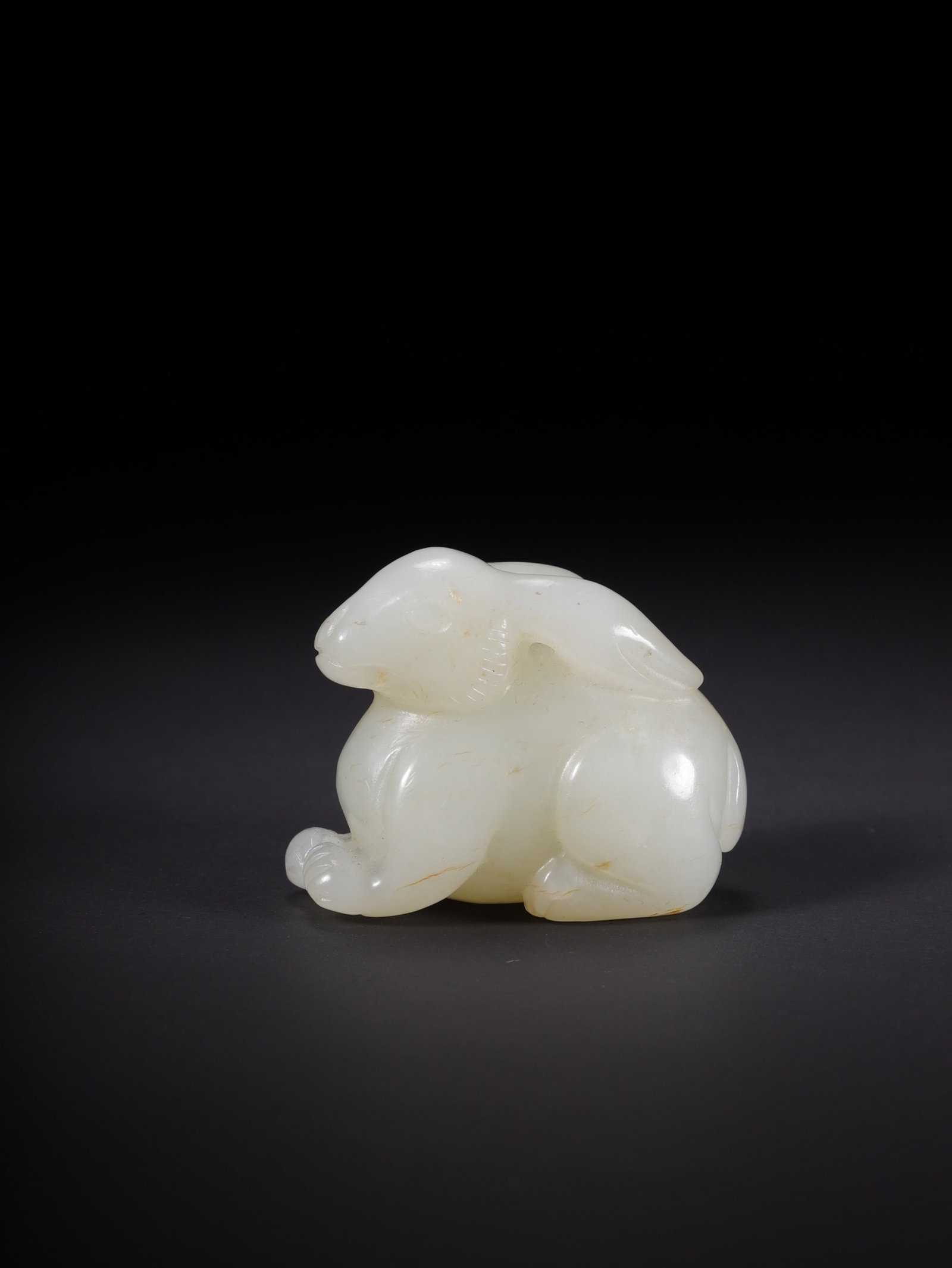 An Exquisite White Jade Rabbit Ornament: An Exquisite White Jade Rabbit Ornament,Qing Dynasty,China,Size:1.7inx1inx1.3in,Weight:44.8g 白玉兔子摆件,中国清代