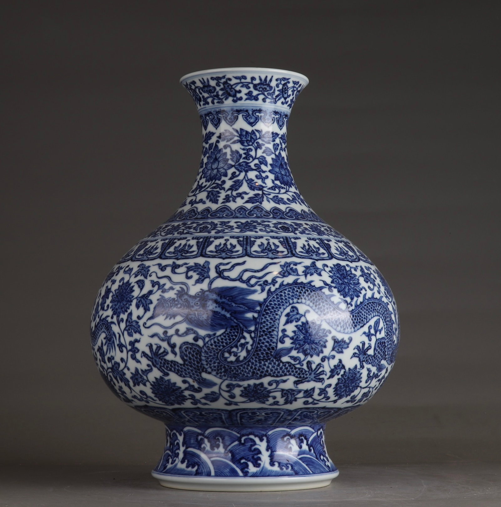 A Rare Blue and White Lotus and Dragon Pattern Vase: A Rare Blue and White Lotus and Dragon Pattern Vase,Qing Dynasty,China,Qianlong Six-character Mark,Size:13.8inx9.8in 青花缠枝莲龙纹瓶,中国&#