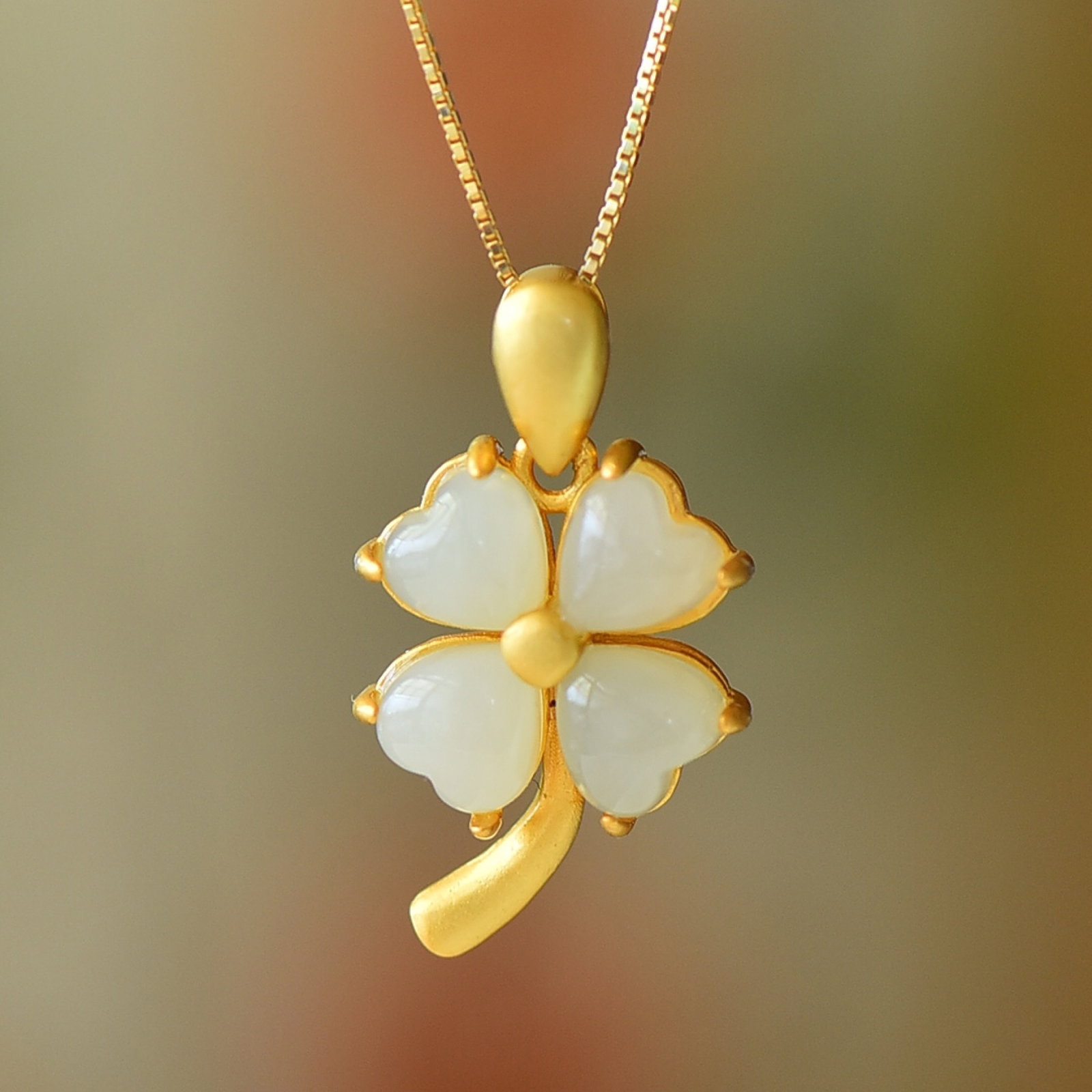 An Exquisite Sterling Silver-Gold Plated Inlaid White Jade Pendant: An Exquisite Sterling Silver-Gold Plated Inlaid White Jade Pendant 纯银镀金镶白玉吊坠