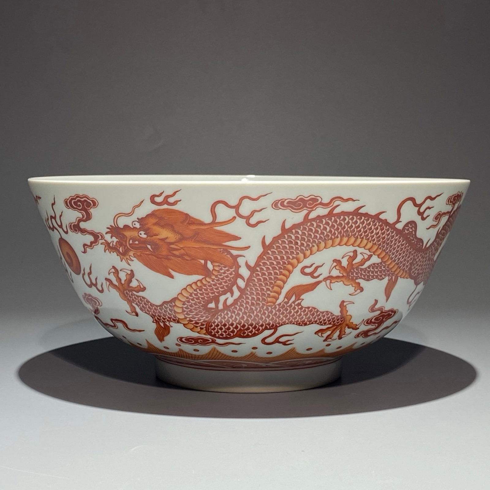 An Exquisite Famille-Rose Iron-Red Auspicious Cloud and Dragon Pattern Bowl: An Exquisite Famille-Rose Iron-Red Auspicious Cloud and Dragon Pattern Bowl,Qing Dynasty,China,Yongzheng Six-character Mark,Size:4.3inx9.1in 粉彩矾红釉祥云